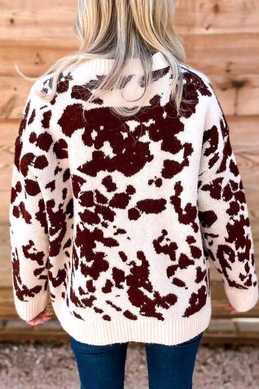 Brown cow print long sleeve pullover knit sweater model back view · nz-alt-v1