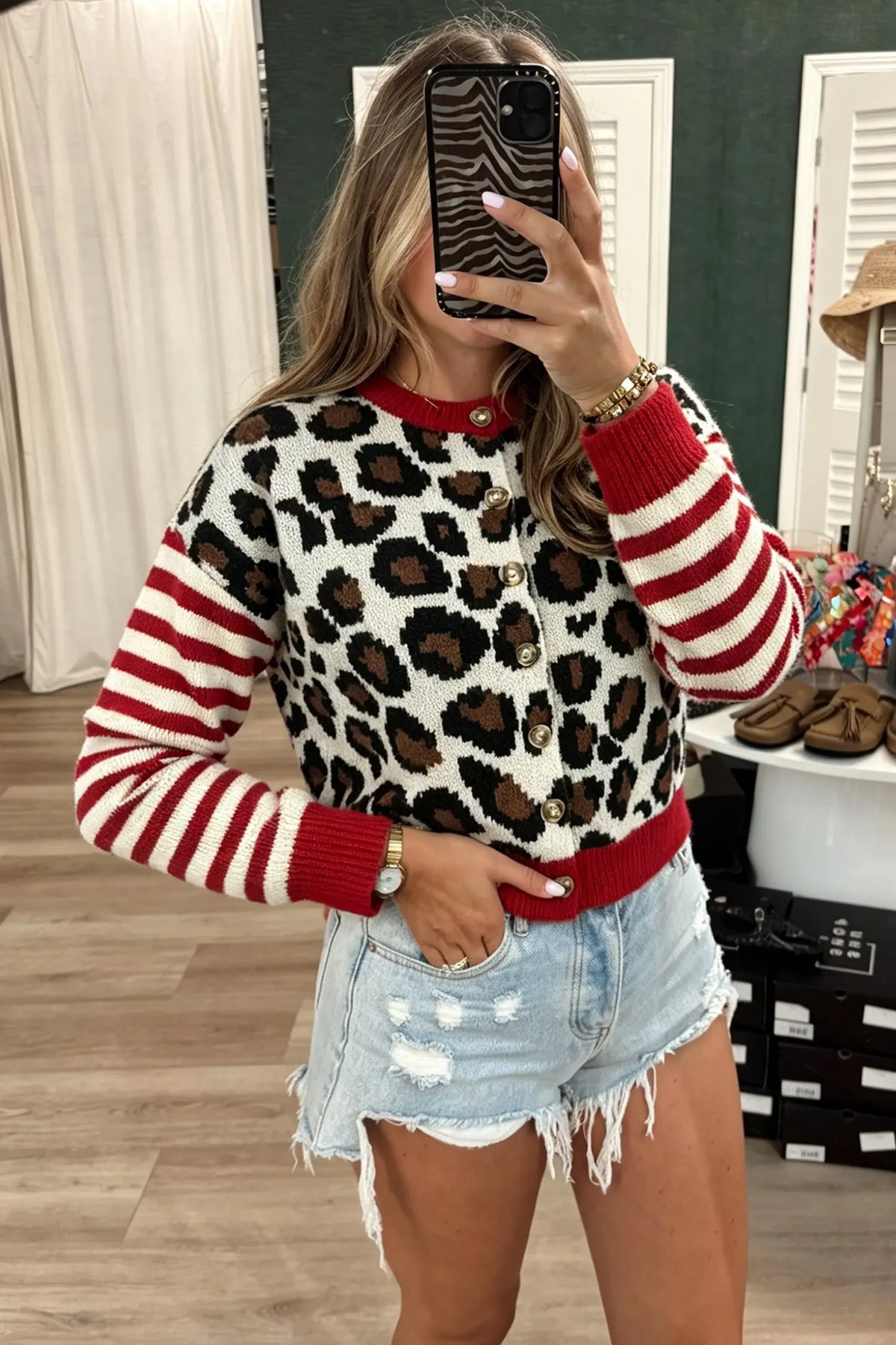 Leopard print cropped cardigan with red striped sleeves, model front view · nz-alt-v1