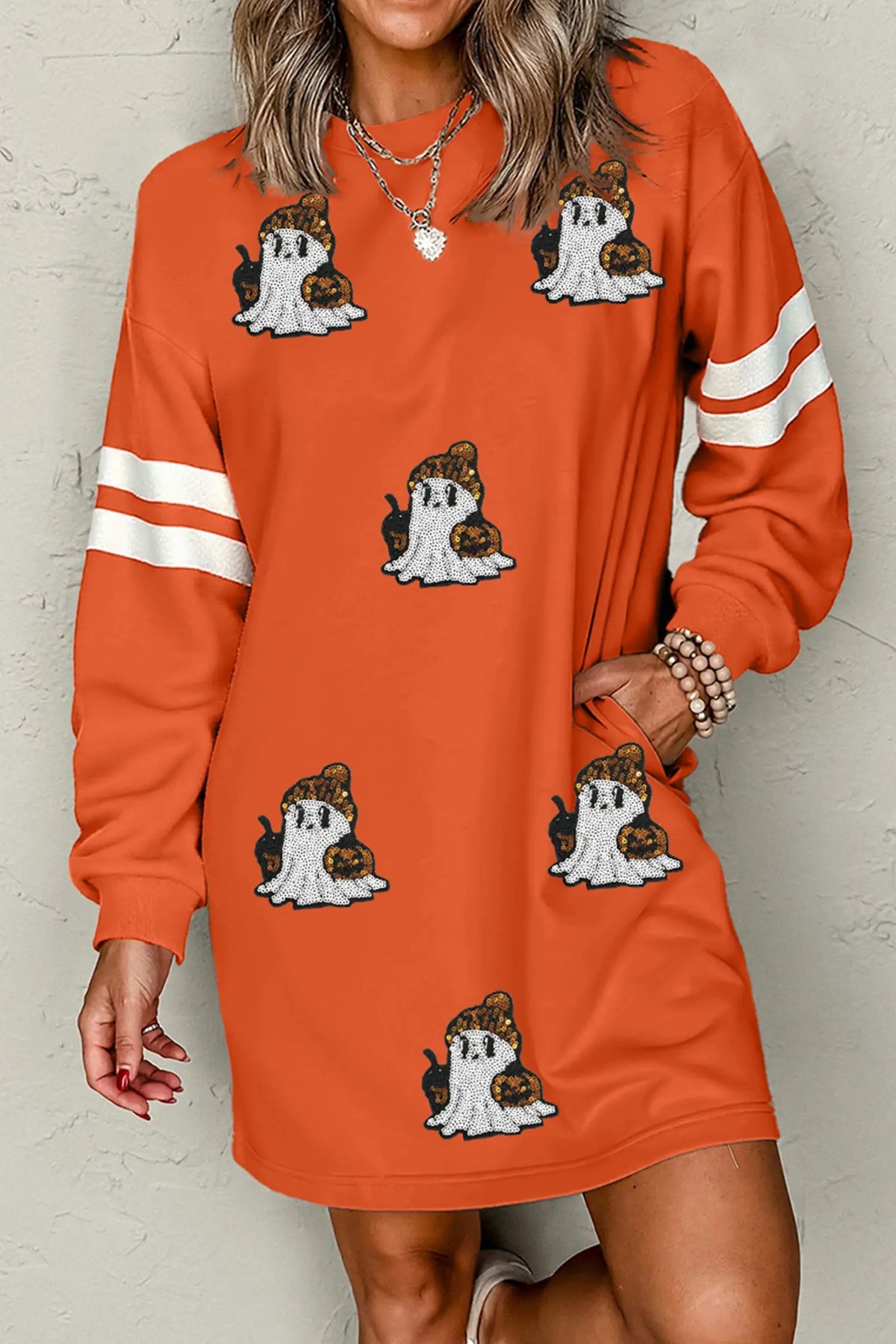 Orange sequin ghost varsity sleeve sweatshirt mini dress model front view · nz-alt-v1