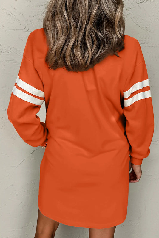 Orange sequin ghost varsity sleeve sweatshirt mini dress model back view · nz-alt-v1