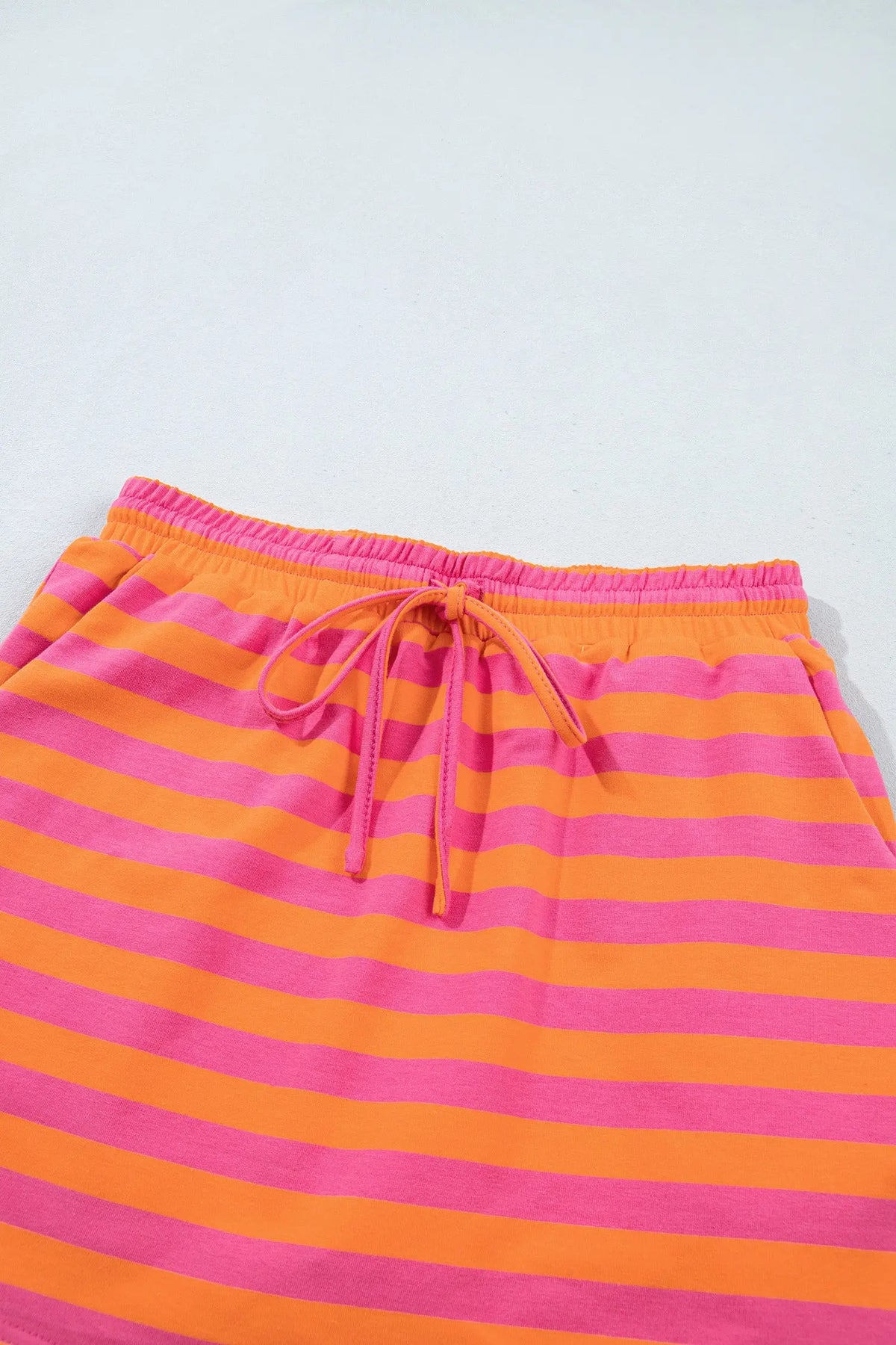 Orange stripe color block patchwork mock neck pullover drawstring mini skort set detail view · nz-alt-v1