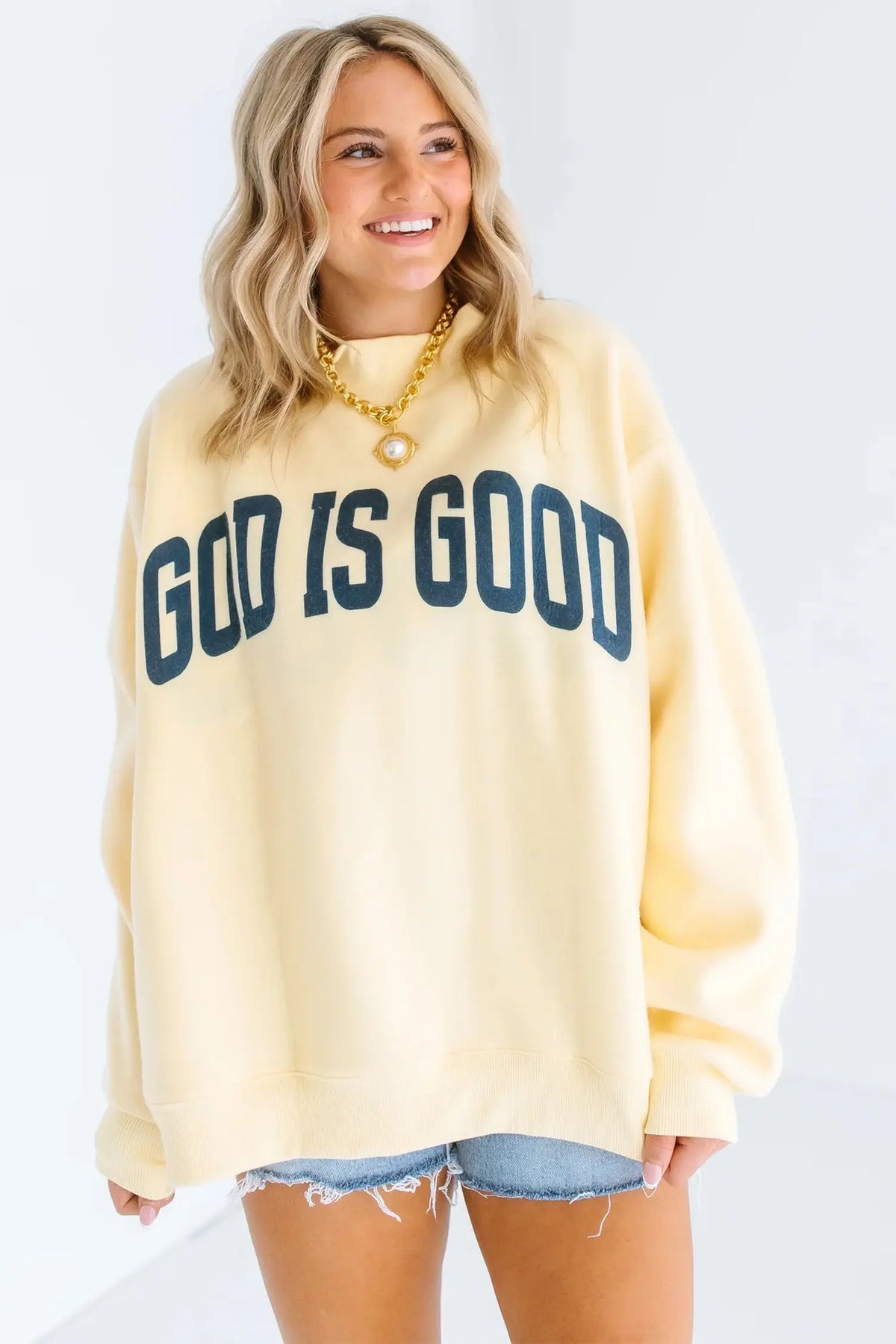Yellow God Is Good slogan stand neck oversized tunic plus size sweatshirt model front view · nz-alt-v1