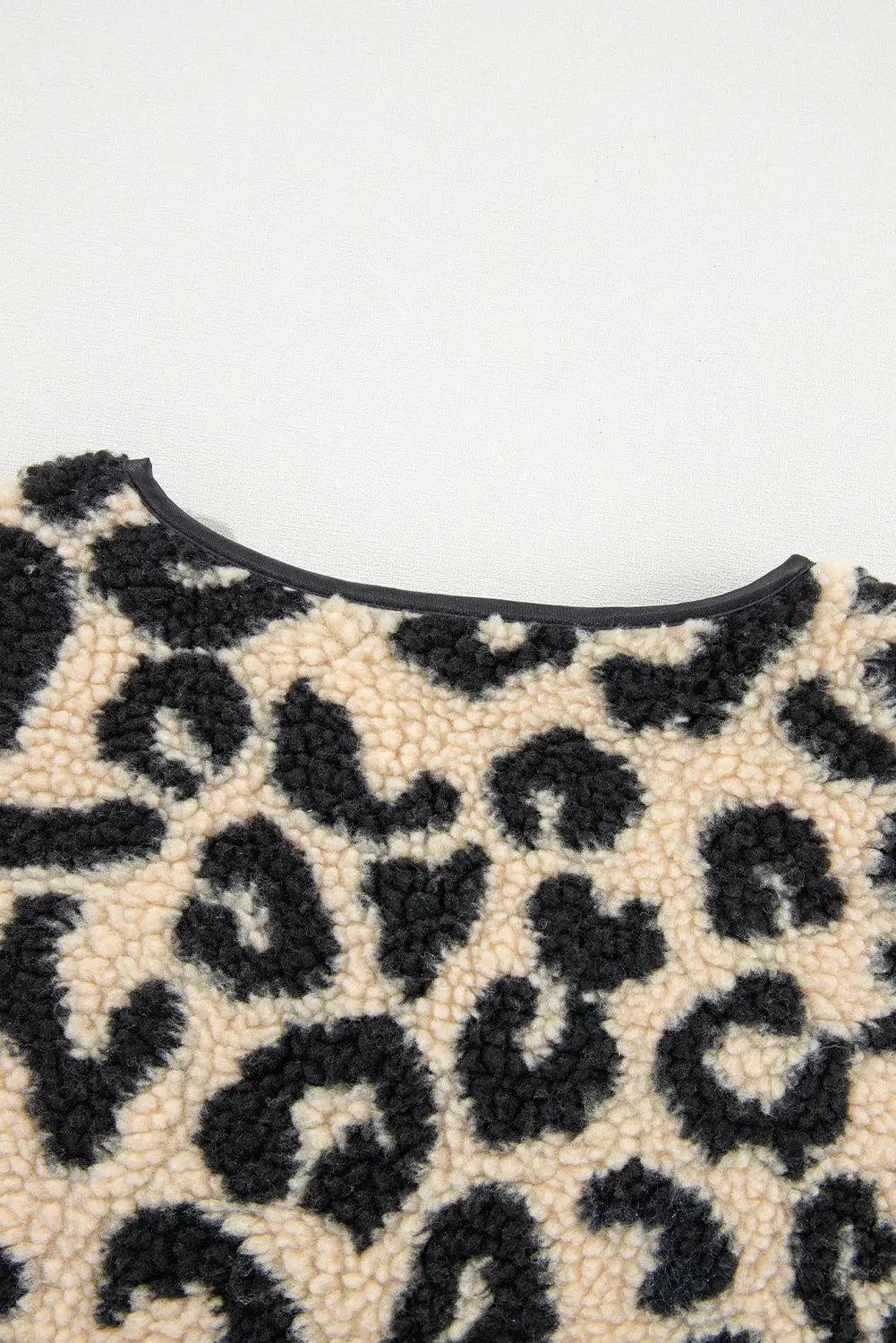 Cream leopard print sherpa vest coat neckline and texture, detail view · nz-alt-v1