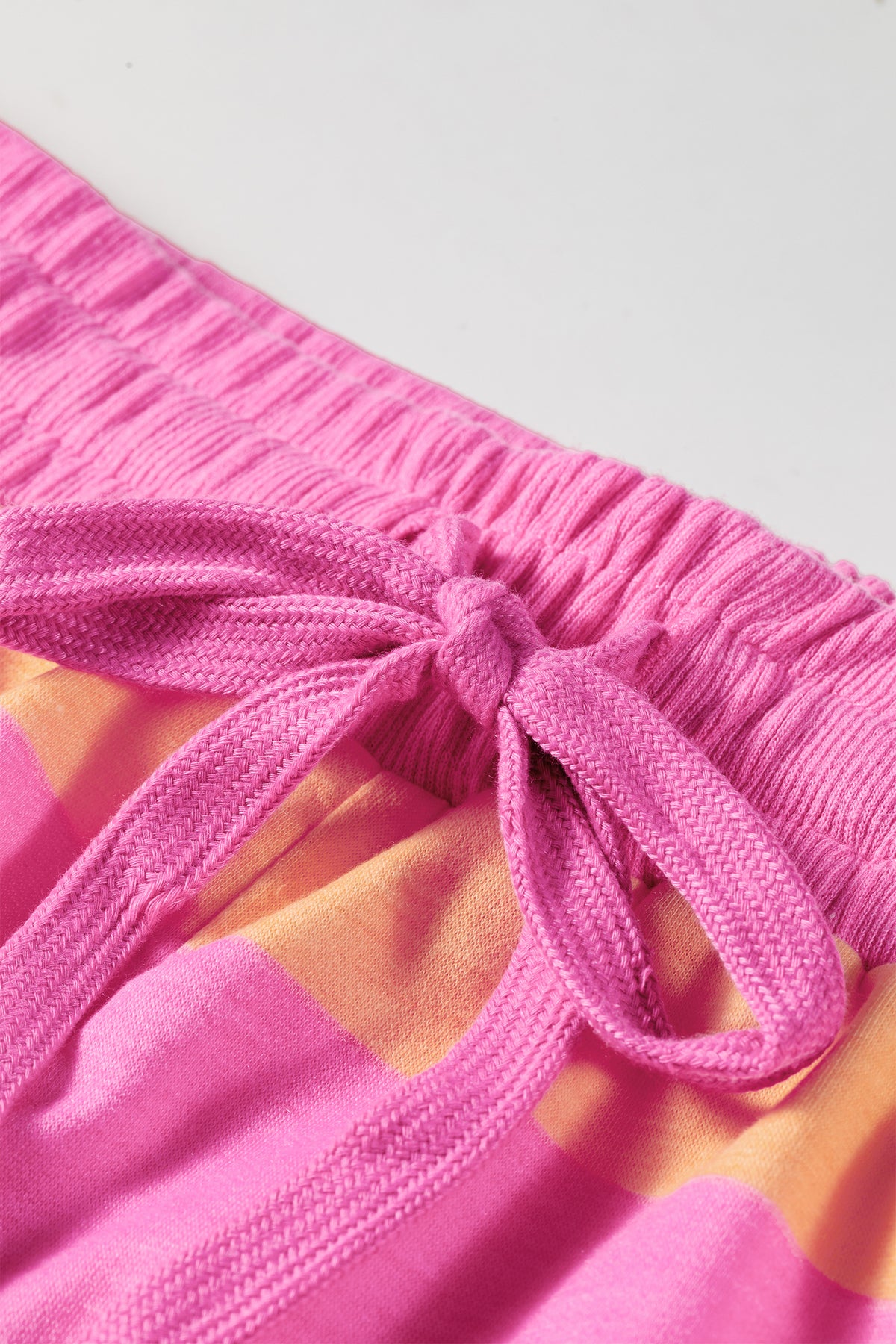 Pink stripe drawstring shorts detail view of knotted drawstring waist