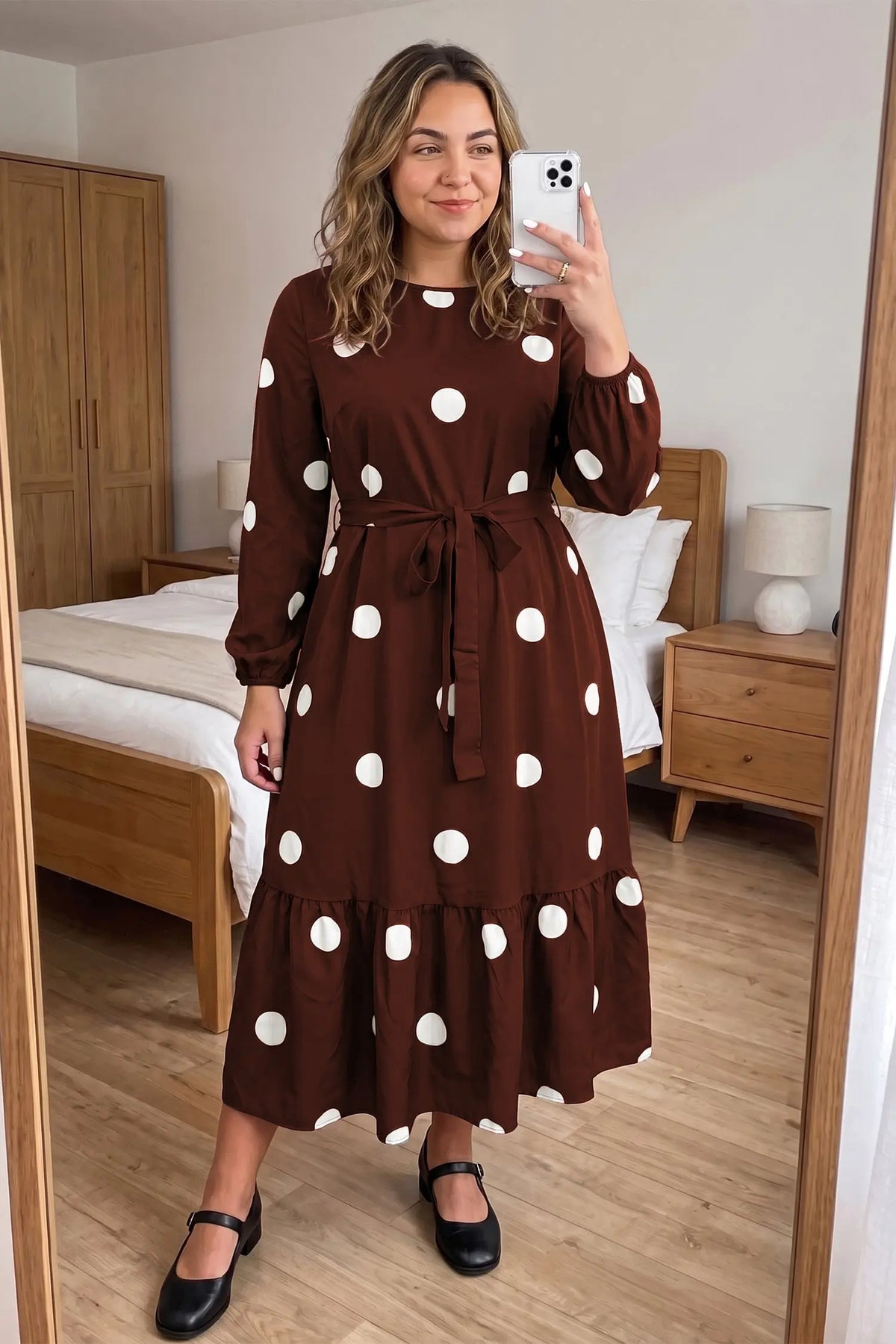 Brown Polka Dot Ruffled Hem Long Sleeve Tie Waist Plus Size Dress model front view · nz-alt-v1