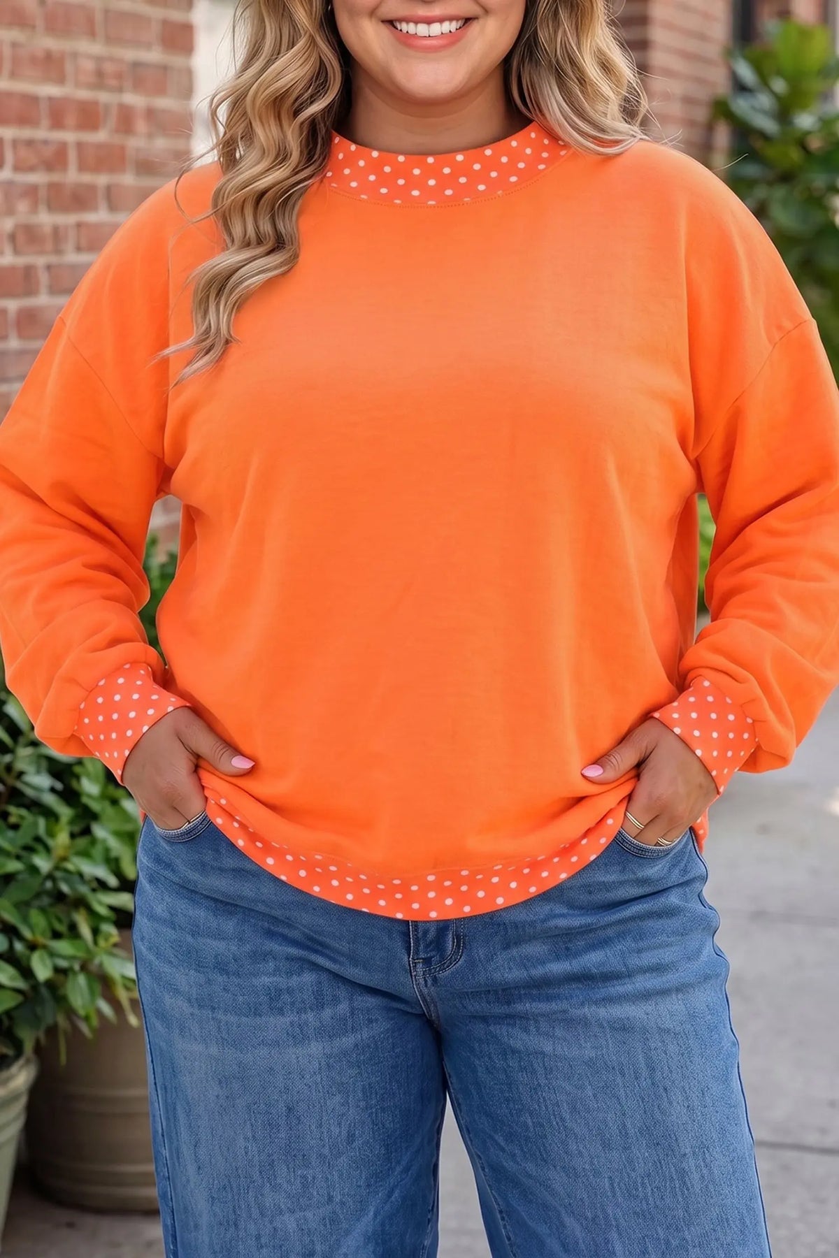Polka dot patchwork round neck plus size sweatshirt orange model front view · nz-alt-v1