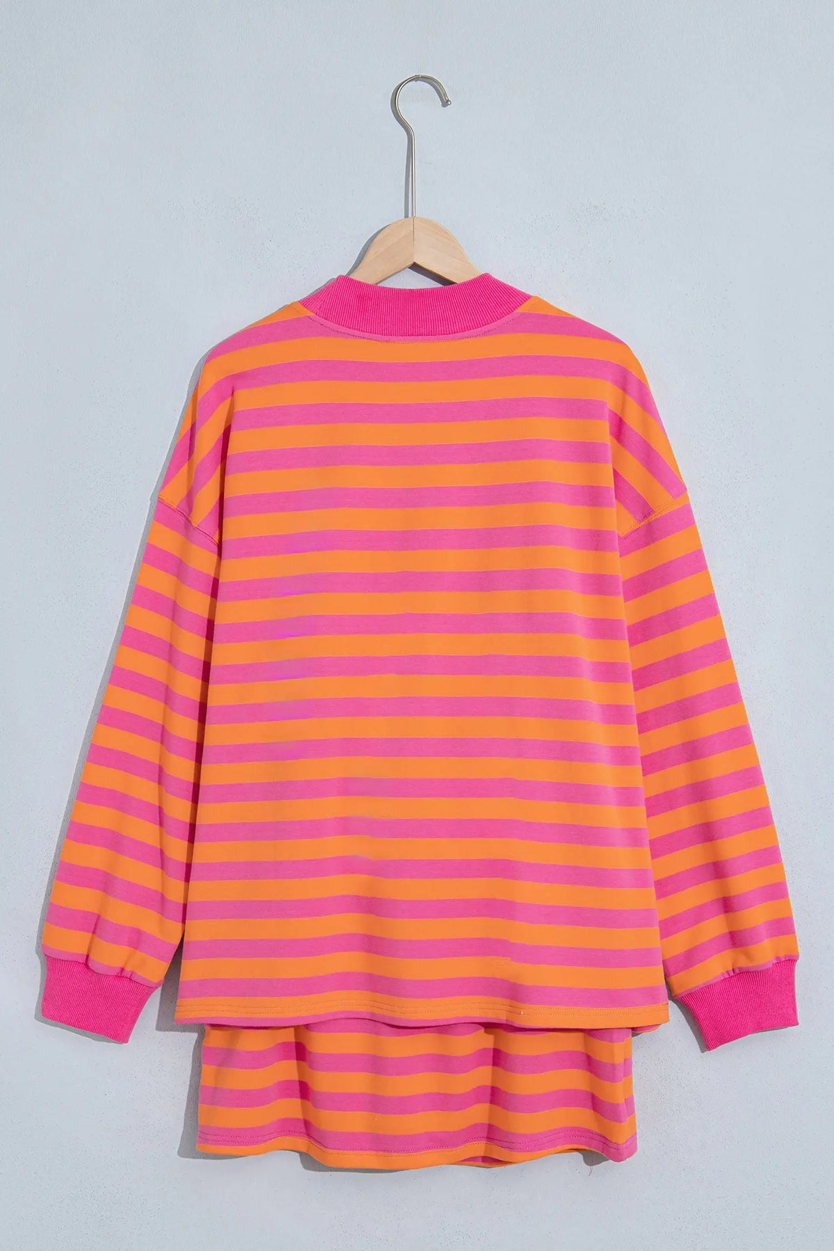 Orange stripe color block patchwork mock neck pullover drawstring mini skort set hanging view · nz-alt-v1