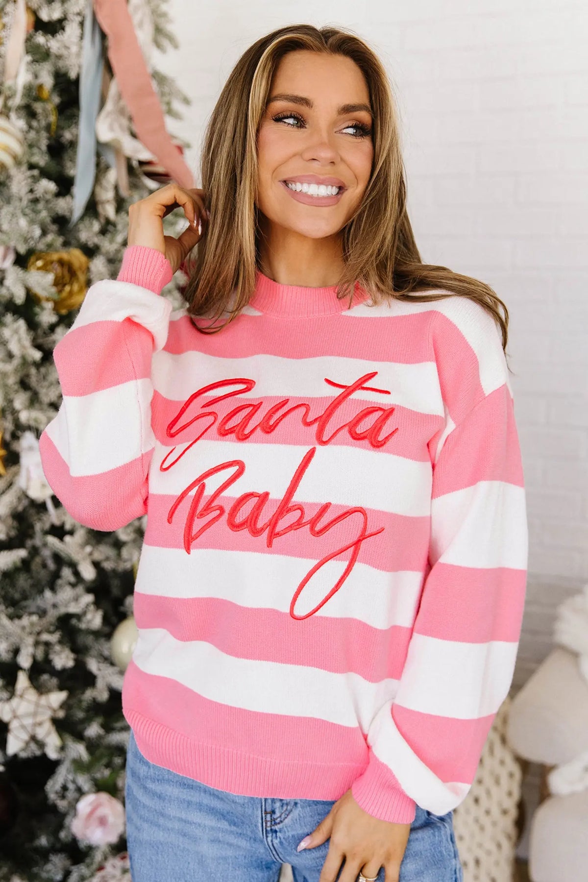 Pink stripe Santa Baby embroidered Christmas pullover sweater model front view · nz-alt-v1