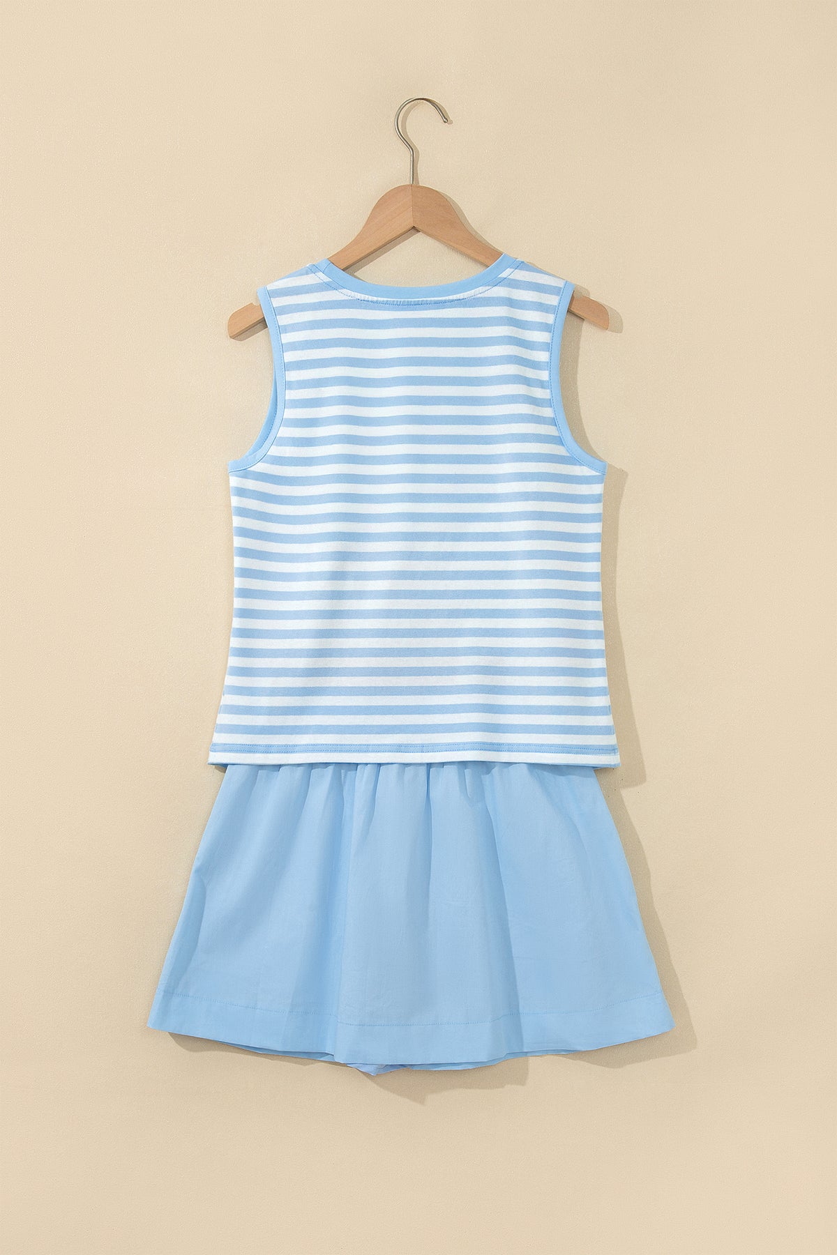 Sky blue stripe slim tank and ruffle mini skort set hanging back view