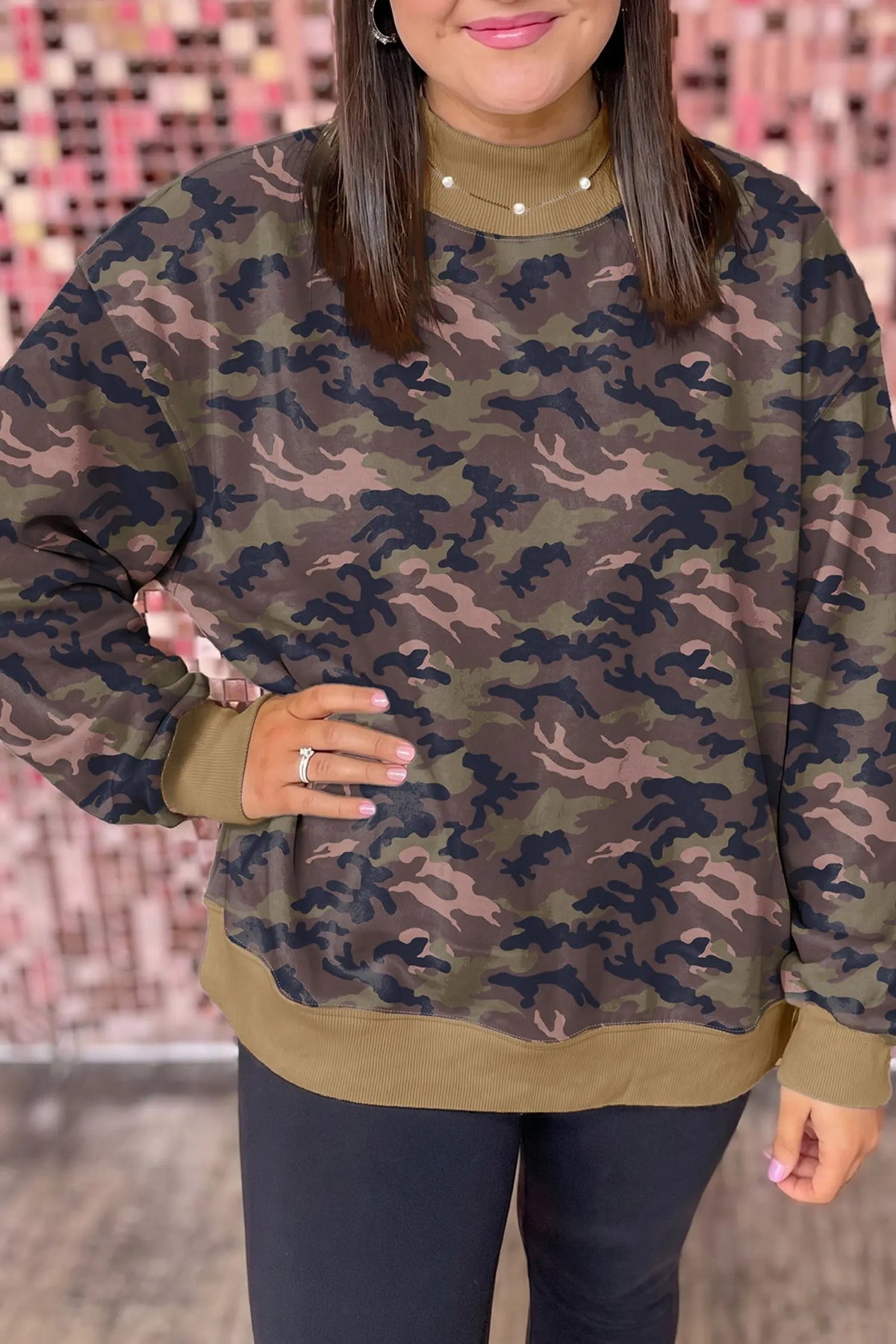 Green camouflage print high neck plus size sweatshirt model front view · nz-alt-v1