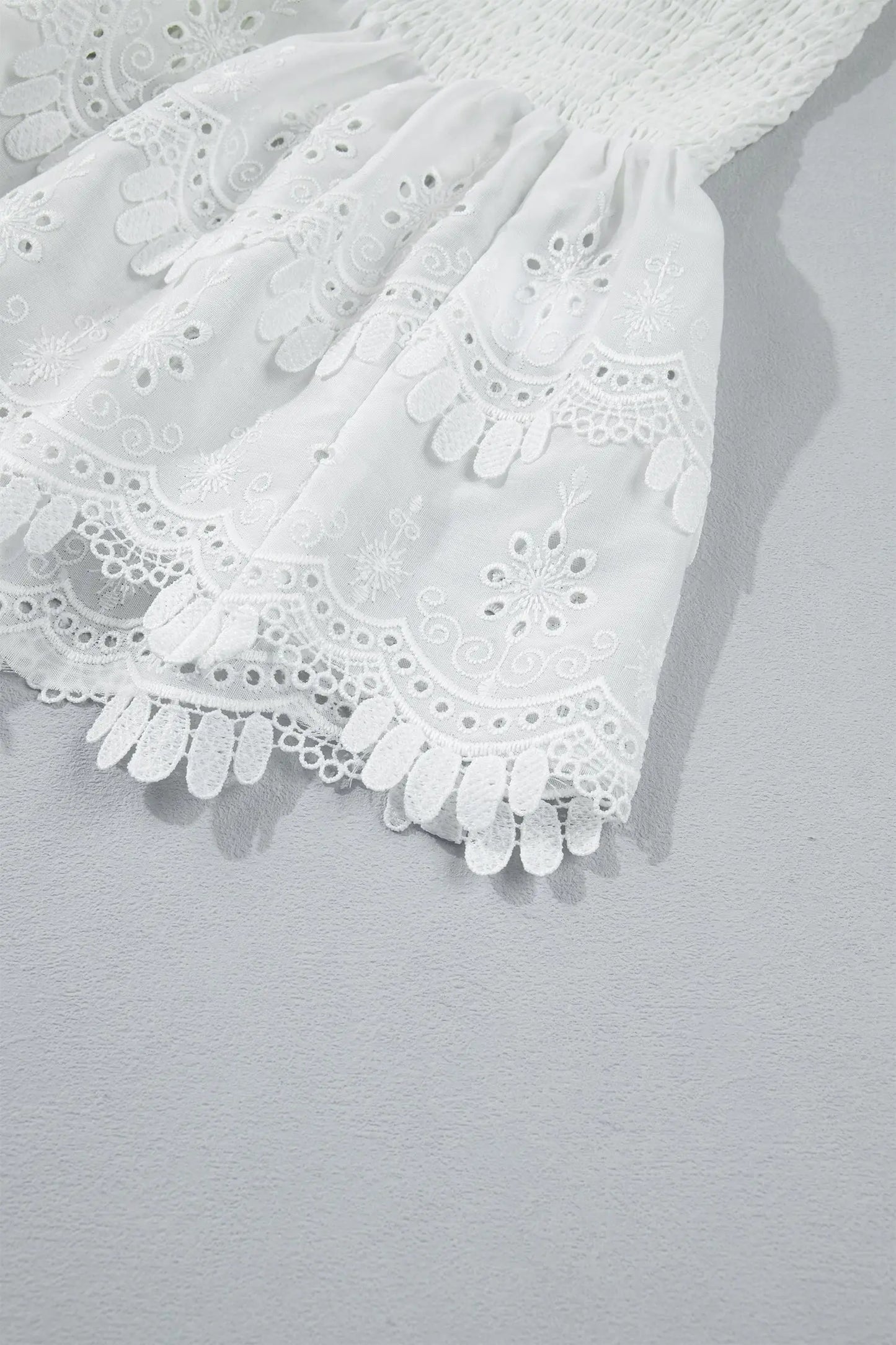 White Sleeveless Smocked Lace Peplum Top