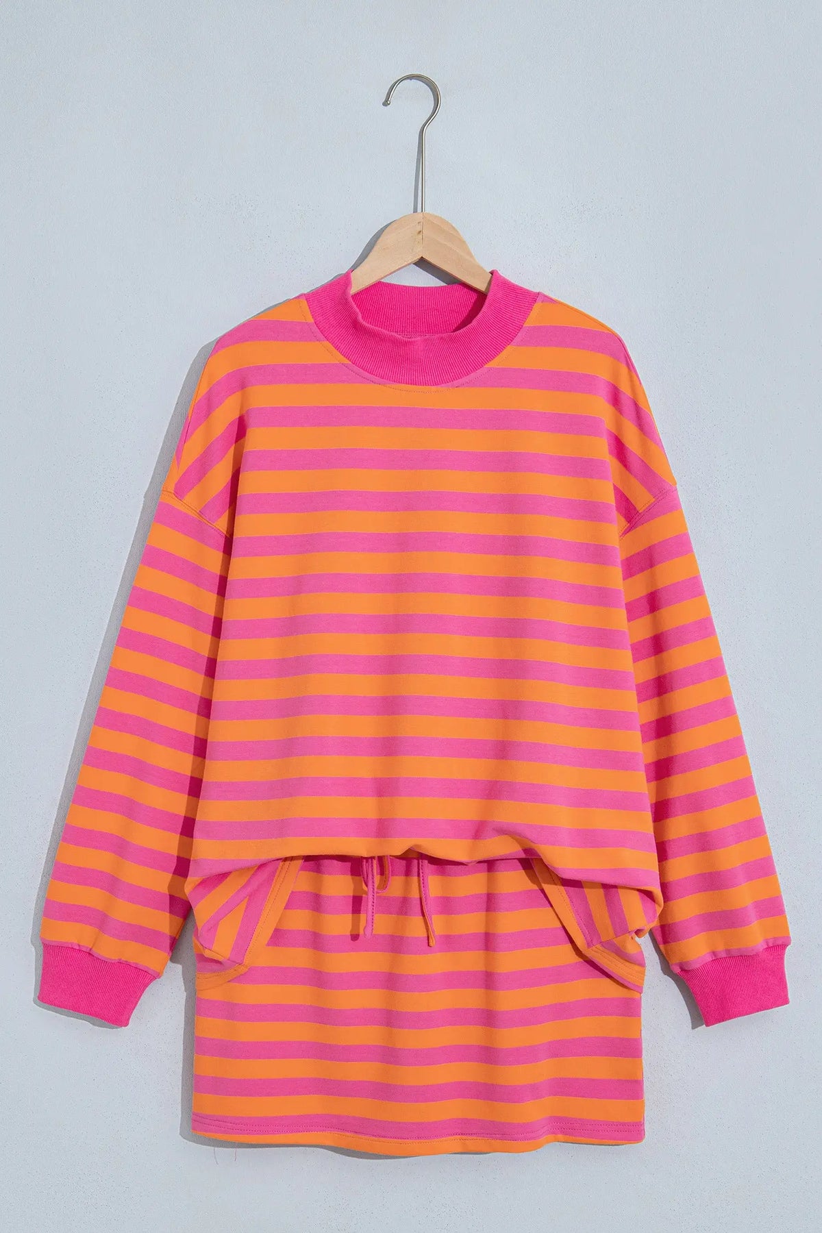 Orange stripe color block patchwork mock neck pullover drawstring mini skort set hanging view · nz-alt-v1