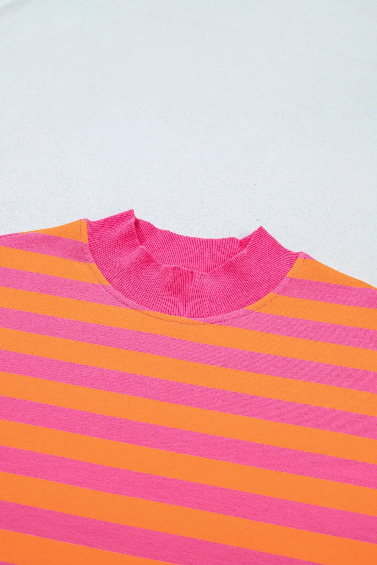 Orange stripe color block patchwork mock neck pullover drawstring mini skort set detail view · nz-alt-v1