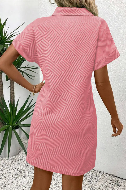 Peach Blossom Solid Color Textured Short Sleeve A Line Mini Dress model back view · nz-alt-v1