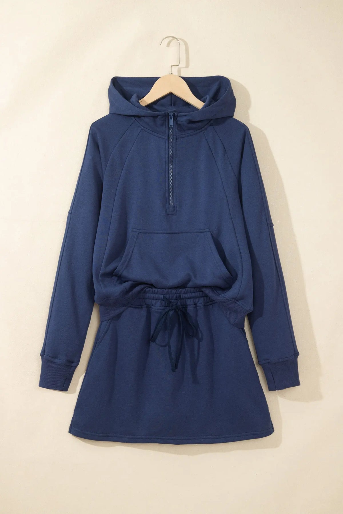 Navy blue long sleeve zip-up top elastic waist skort set hanging view · nz-alt-v1
