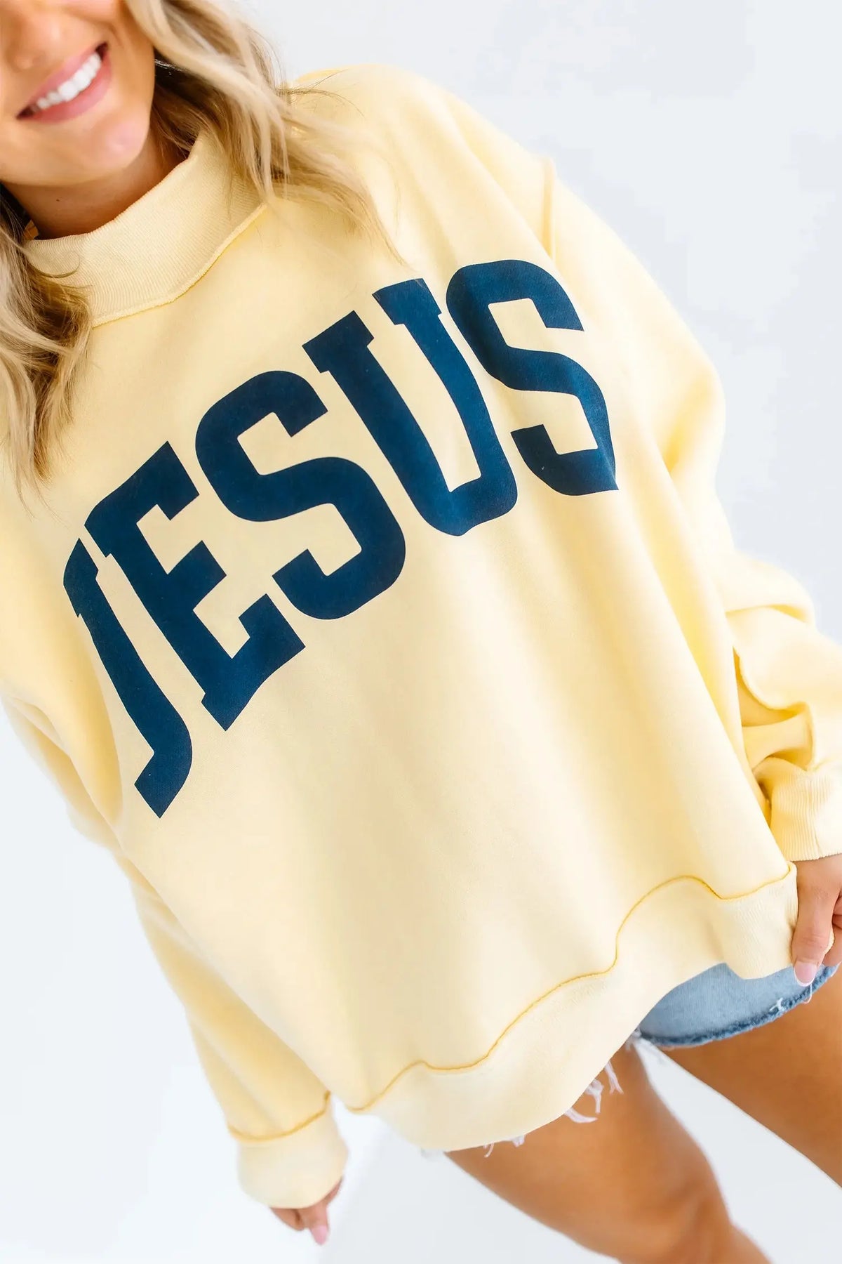 Yellow Jesus slogan stand neck oversized tunic plus size sweatshirt model front view · nz-alt-v1
