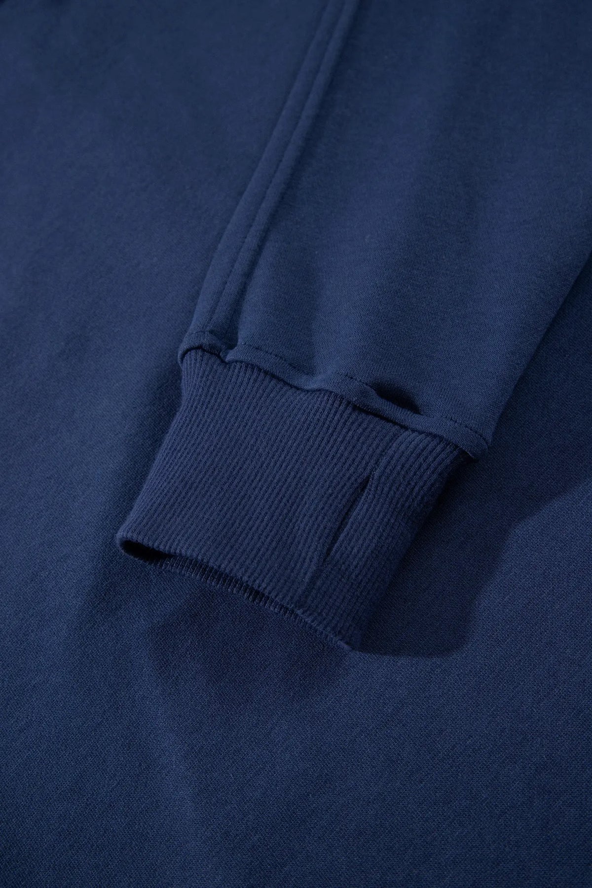 Navy blue long sleeve zip-up top elastic waist skort set detail view · nz-alt-v1