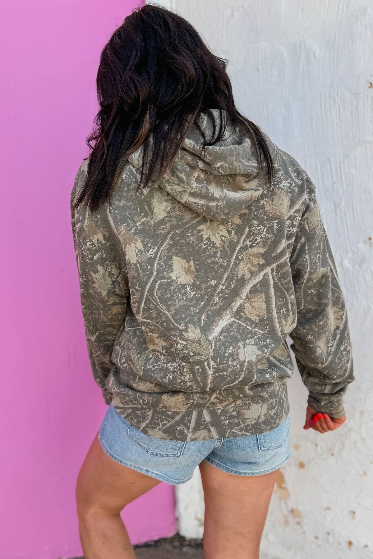 Multicolour camouflage Jesus Loves You print relaxed hoodie model back view · nz-alt-v1