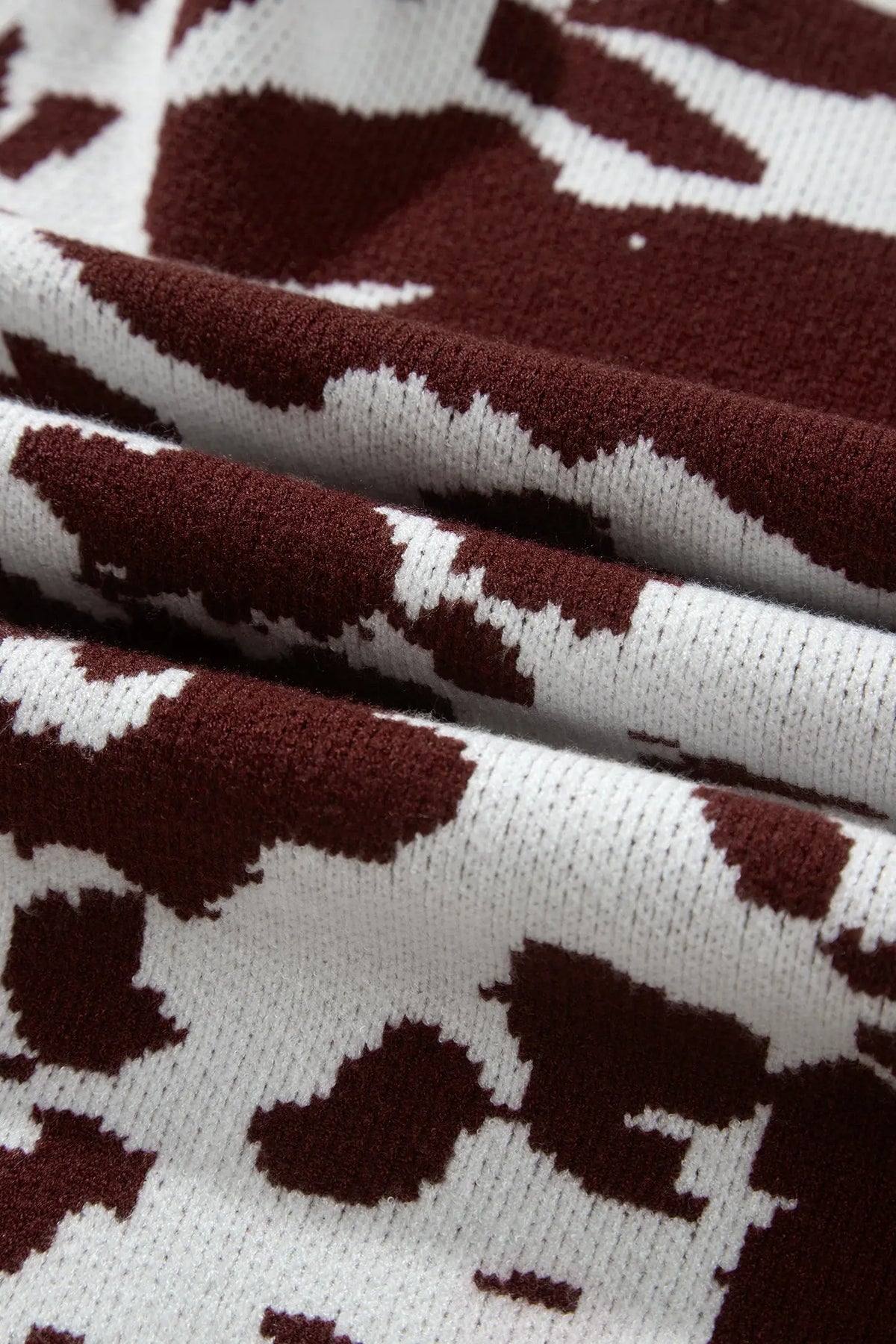 Brown cow print long sleeve pullover knit sweater detail view · nz-alt-v1