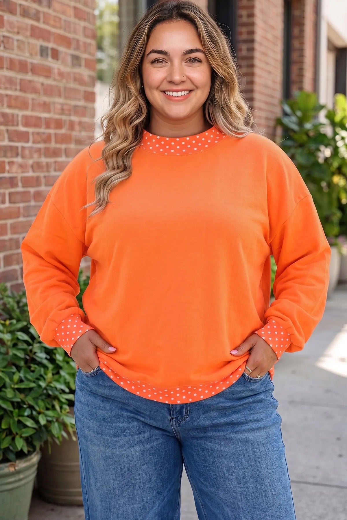 Polka dot patchwork round neck plus size sweatshirt orange model front view · nz-alt-v1