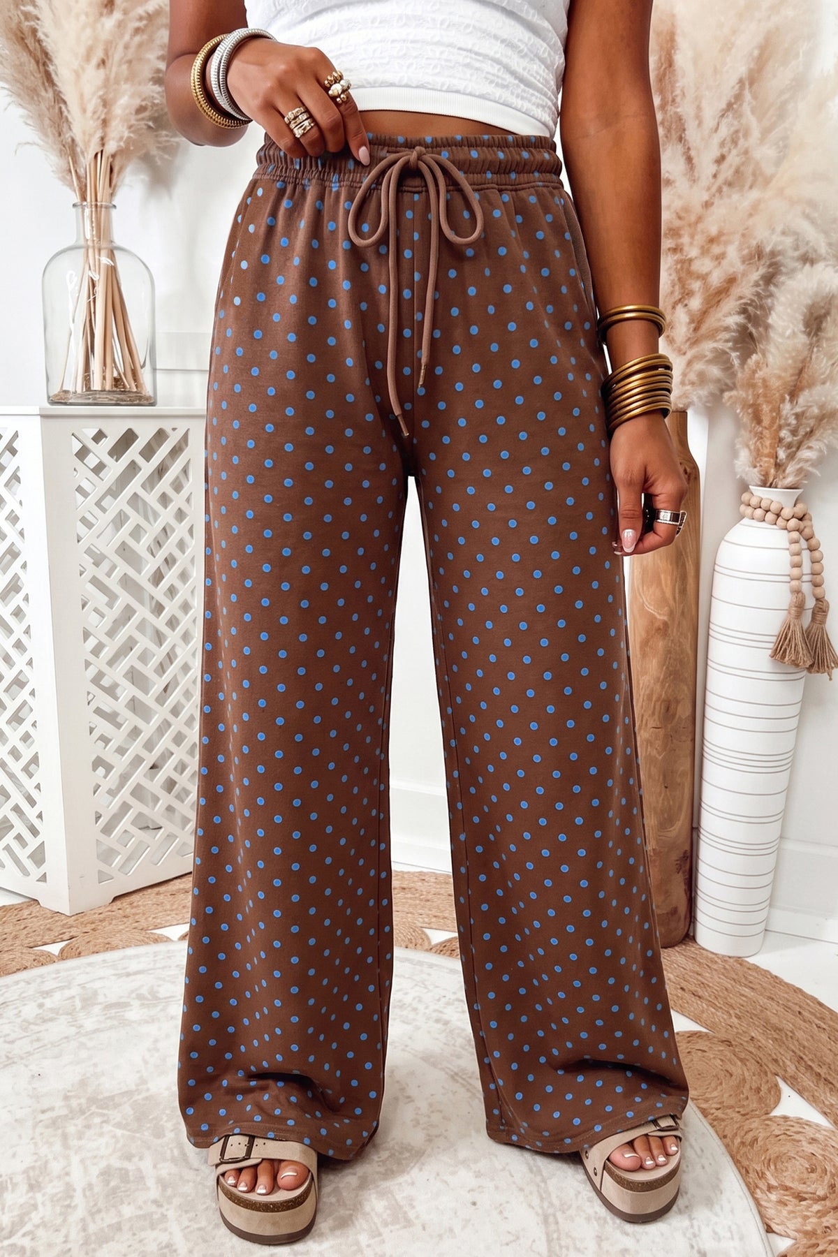 Brown casual polka dot wide leg drawstring pants model front view · nz-alt-v1