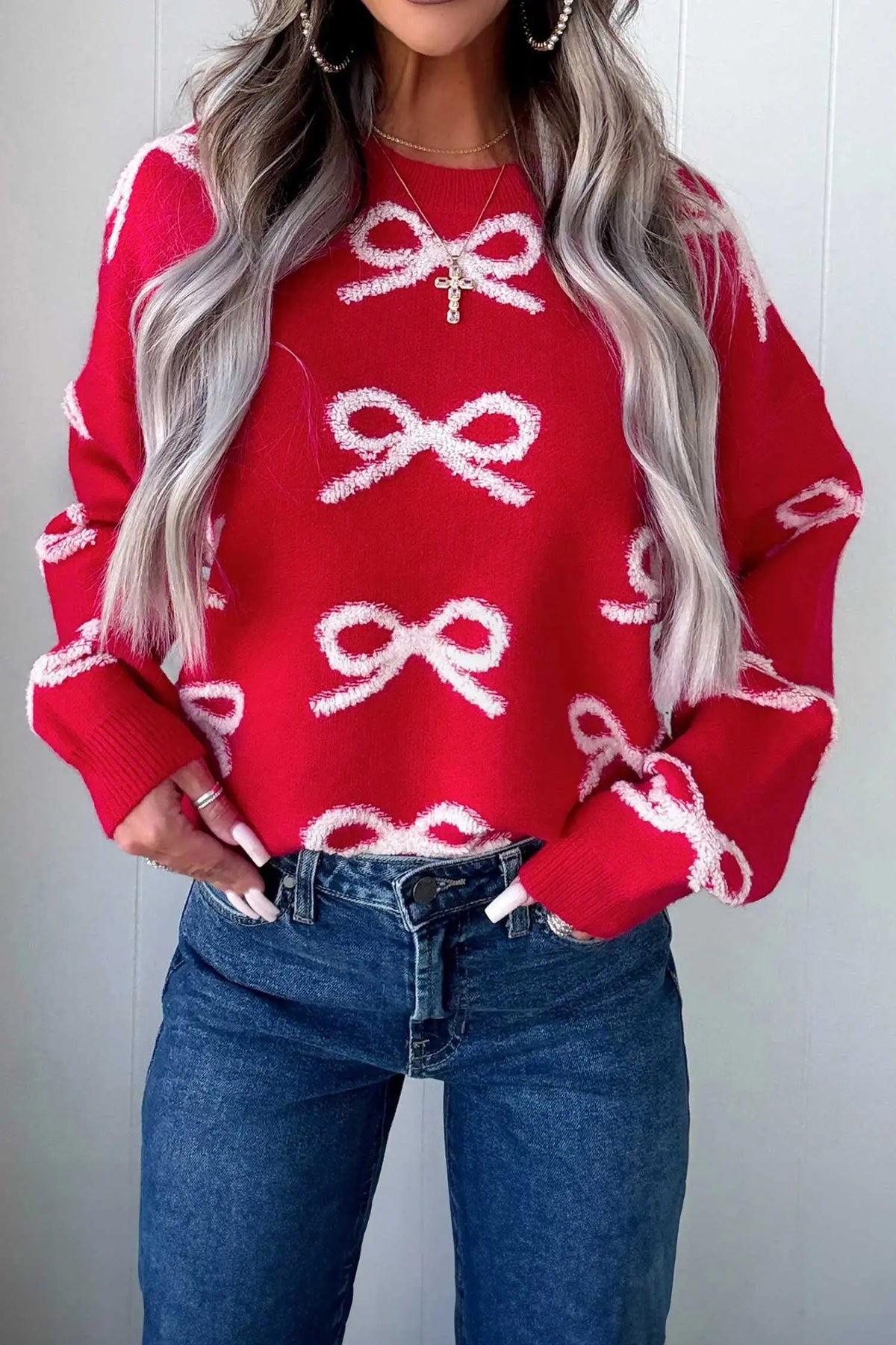 Fiery Red All Over Bow Dropped Shoulder Round Neck Shift Sweater model front view · nz-alt-v1