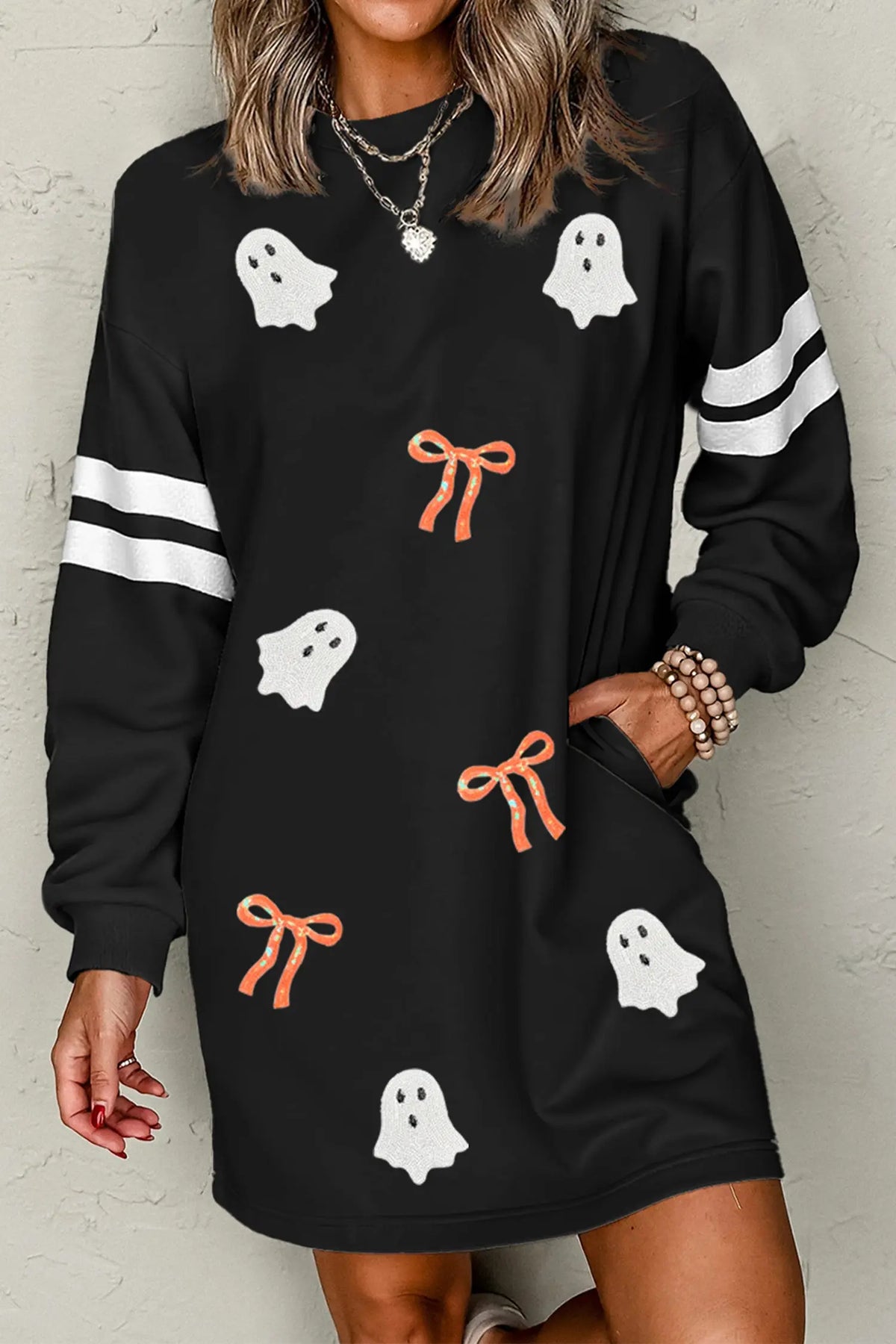 Black sequin ghost varsity striped sleeve Halloween sweatshirt dress model front view · nz-alt-v1
