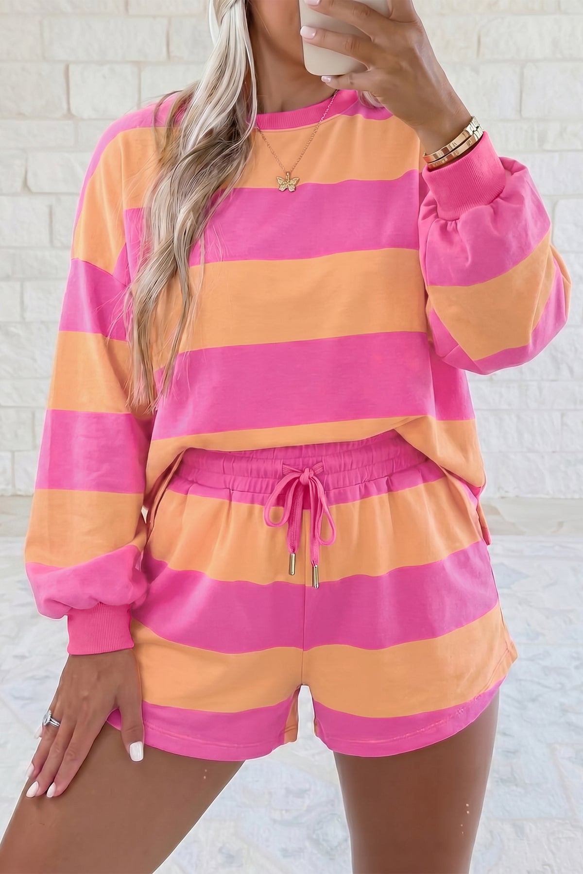 Pink stripe long sleeve top and drawstring shorts set model front view