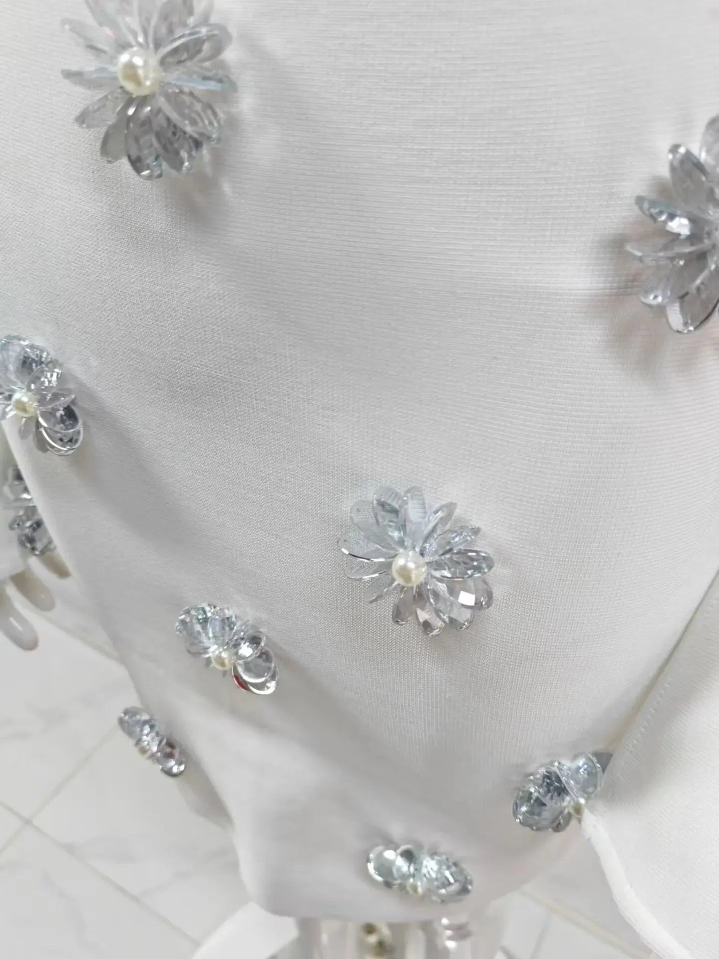 Beaded Cutout Mini Knitted Long Sleeves White Dress beading close-up · nz-bg-v1