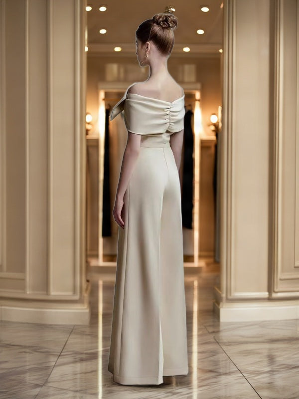 Off-Shoulder Bow Wide-Leg Jumpsuit in Champagne model back view · nz-bg-v1