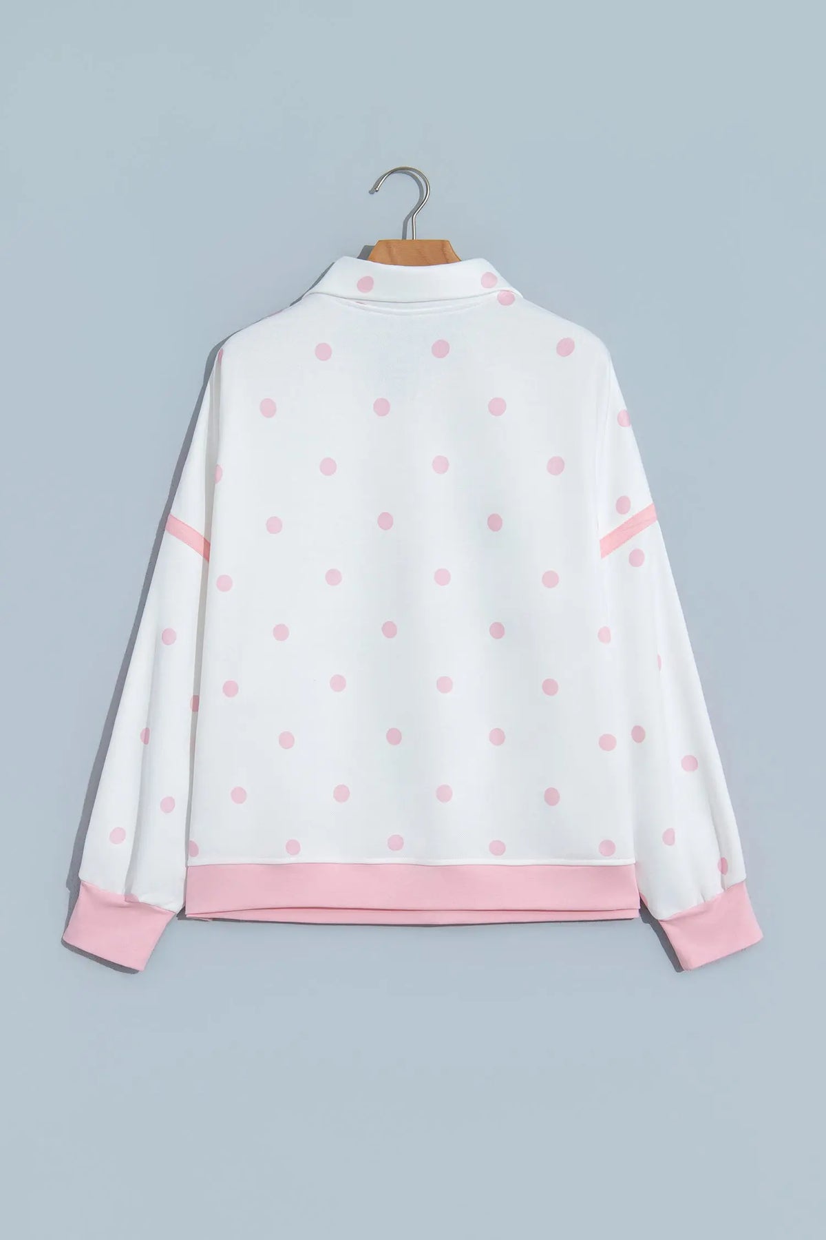 Pink Polka Dot Half Zip Drop Shoulder Relaxed Sweatshirt hanging view · nz-alt-v1
