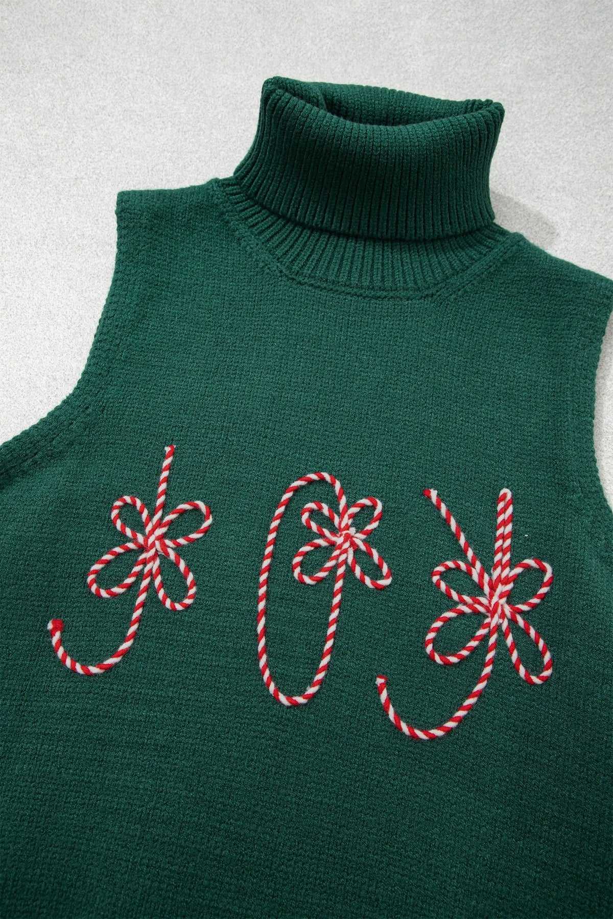 Evergreen high neck sleeveless embroidered knit sweater vest flat lay view · nz-alt-v1