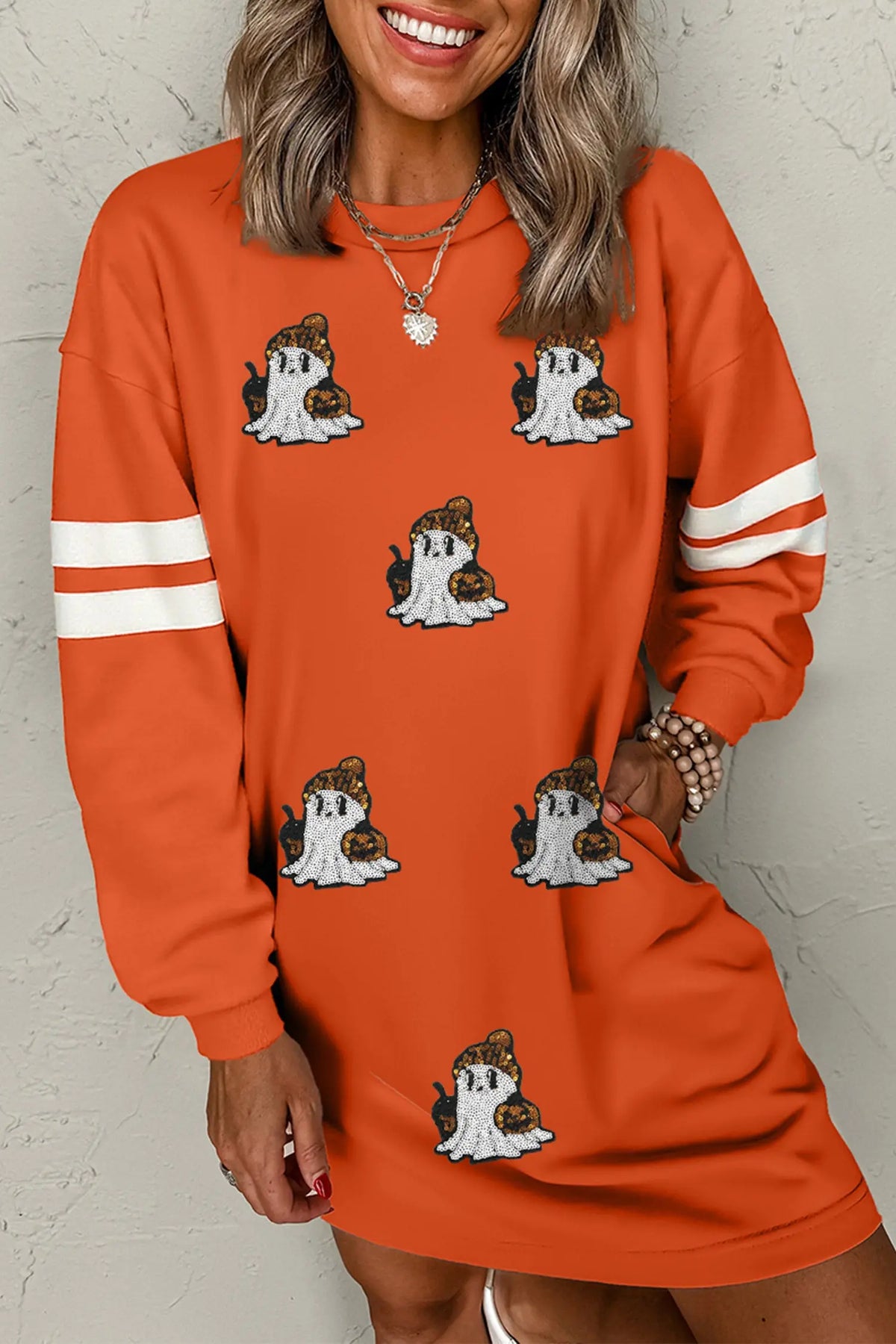 Orange sequin ghost varsity sleeve sweatshirt mini dress model front view · nz-alt-v1
