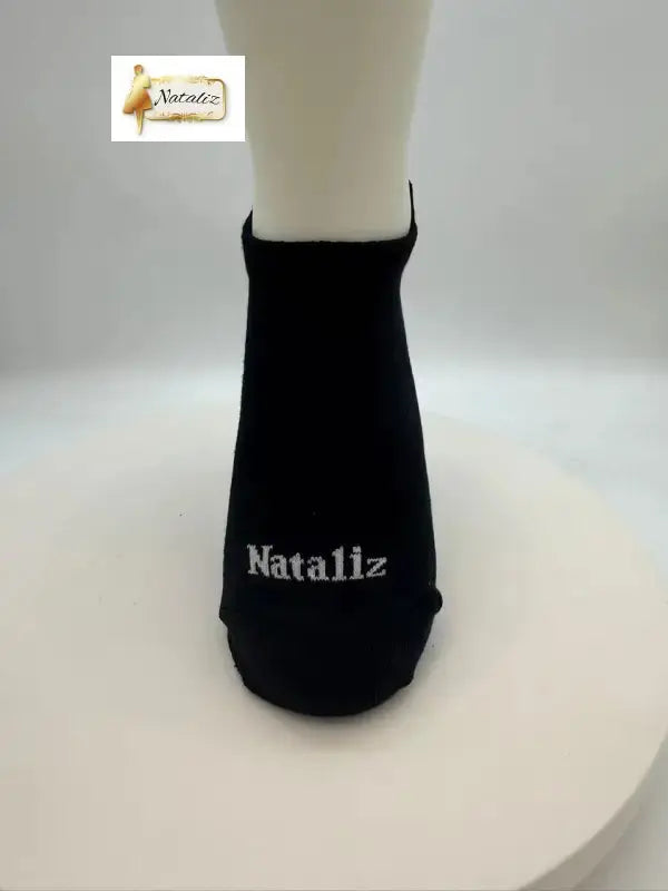 Black ankle sock with 'Nataliz' branding on a white background