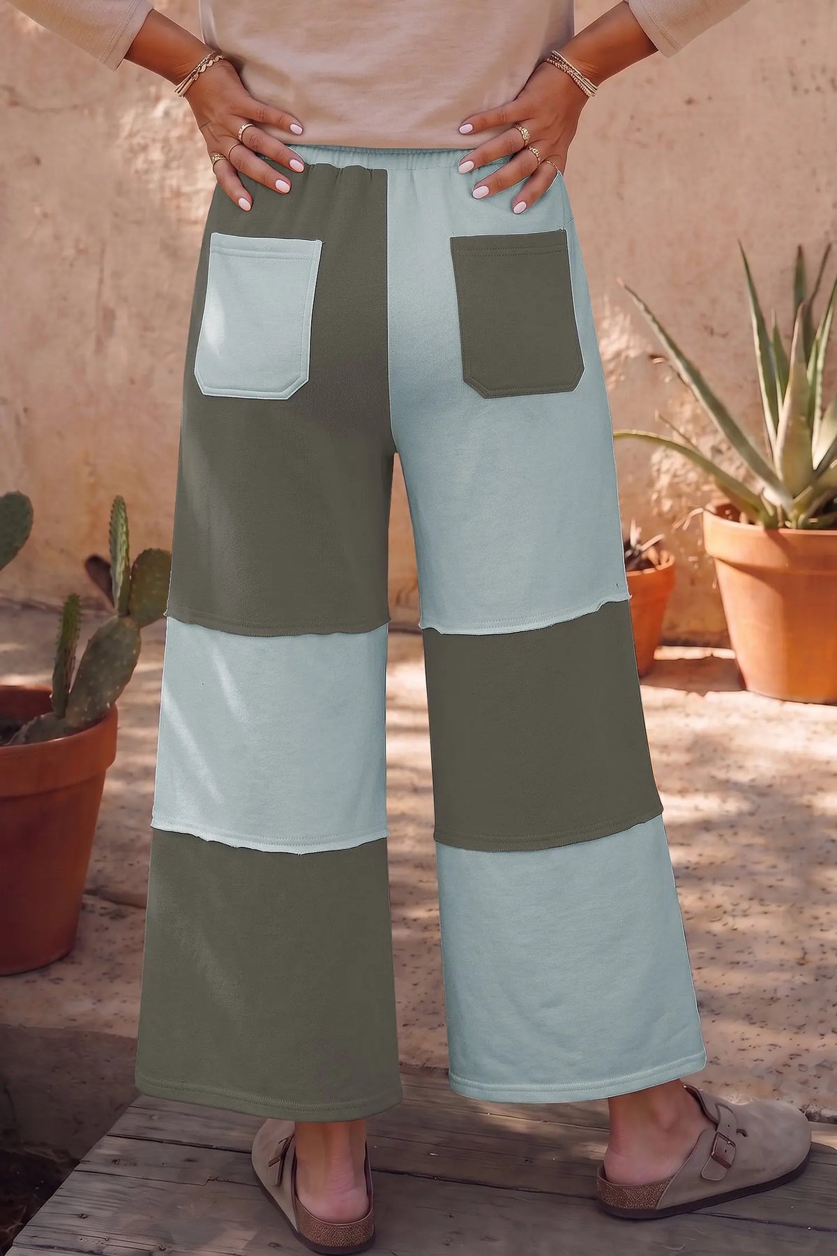 Beau Blue raw seam colorblock wide leg ankle length casual pants model back view · nz-alt-v1