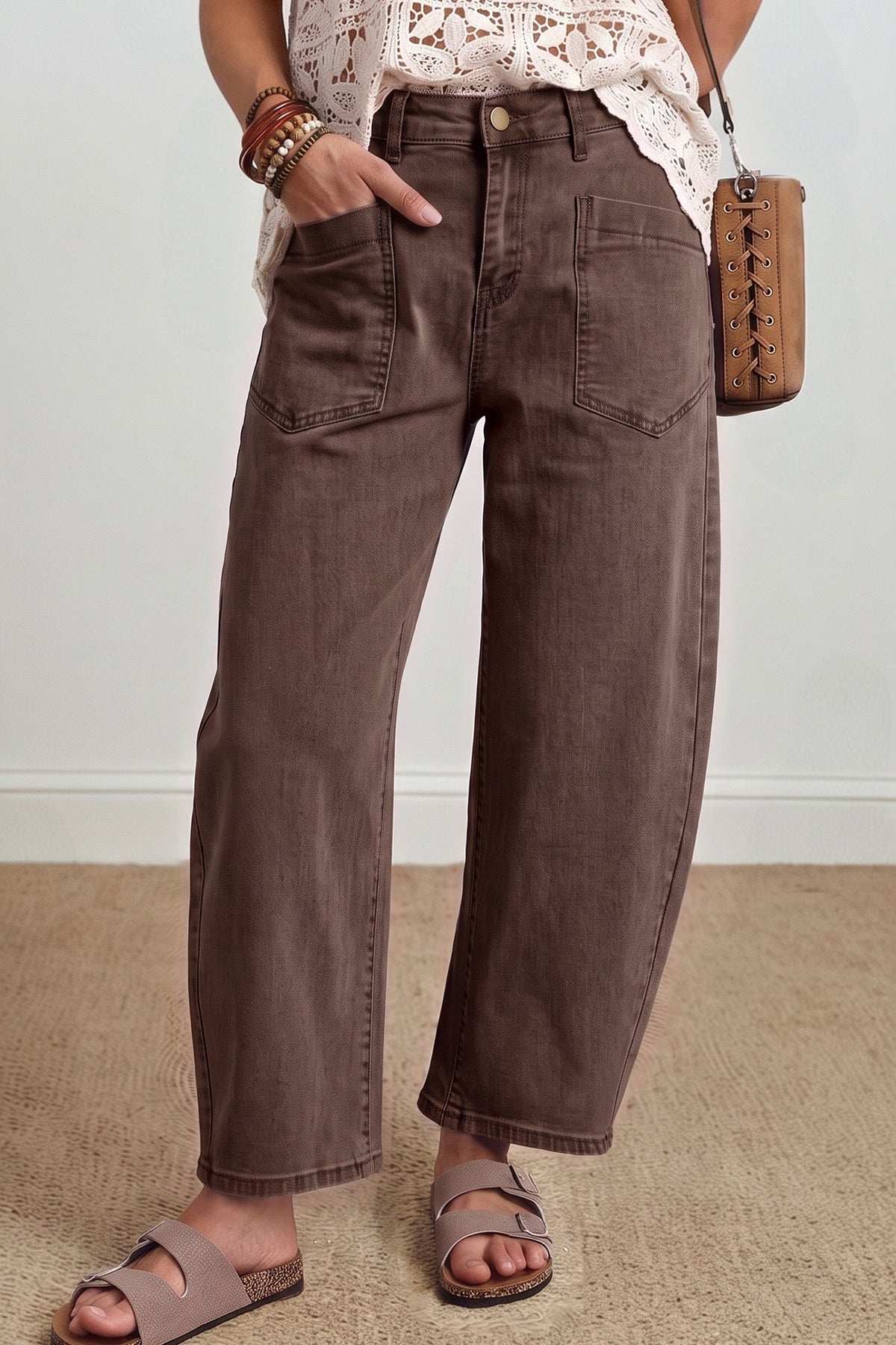 Solid color barrel jeans in coffee, model front view