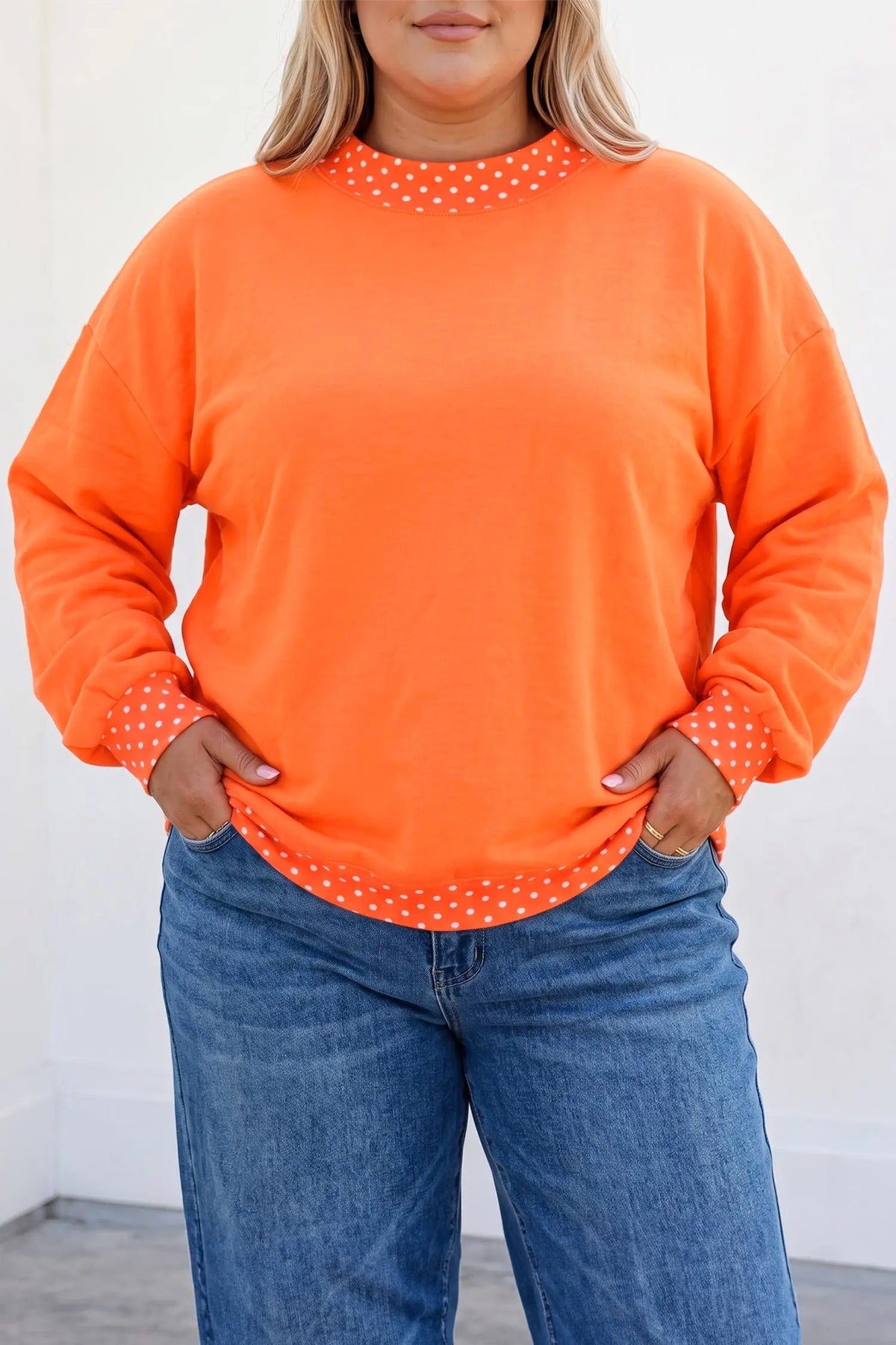 Polka dot patchwork round neck plus size sweatshirt orange model front view · nz-alt-v1