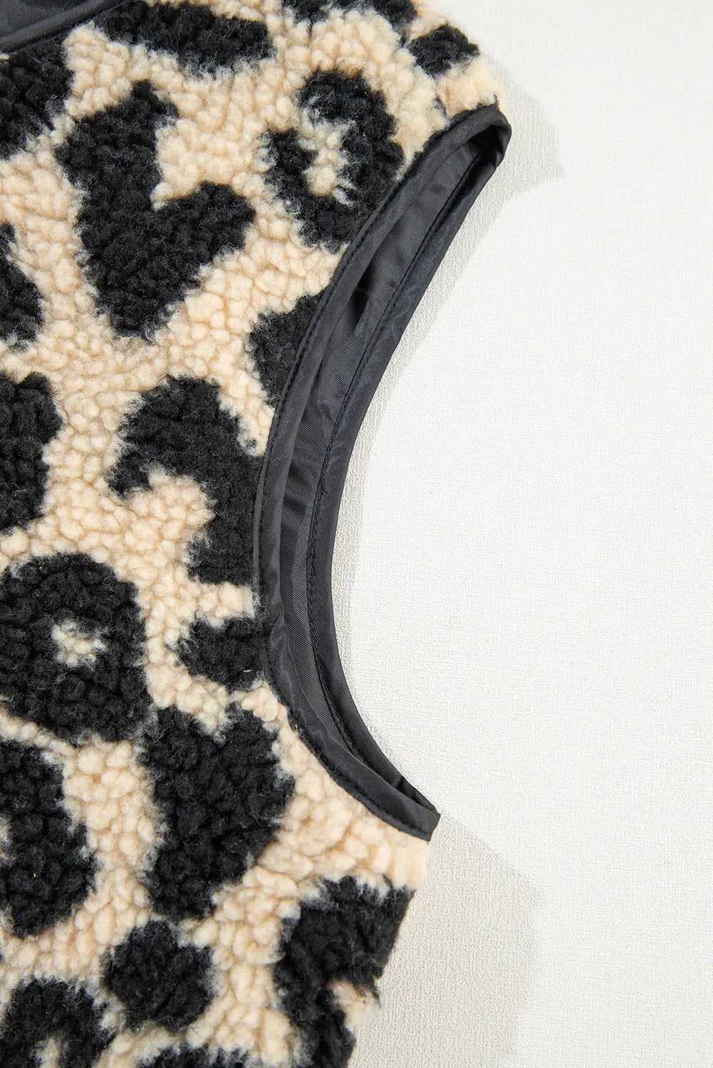 Cream leopard print sherpa vest coat armhole trim, detail view · nz-alt-v1