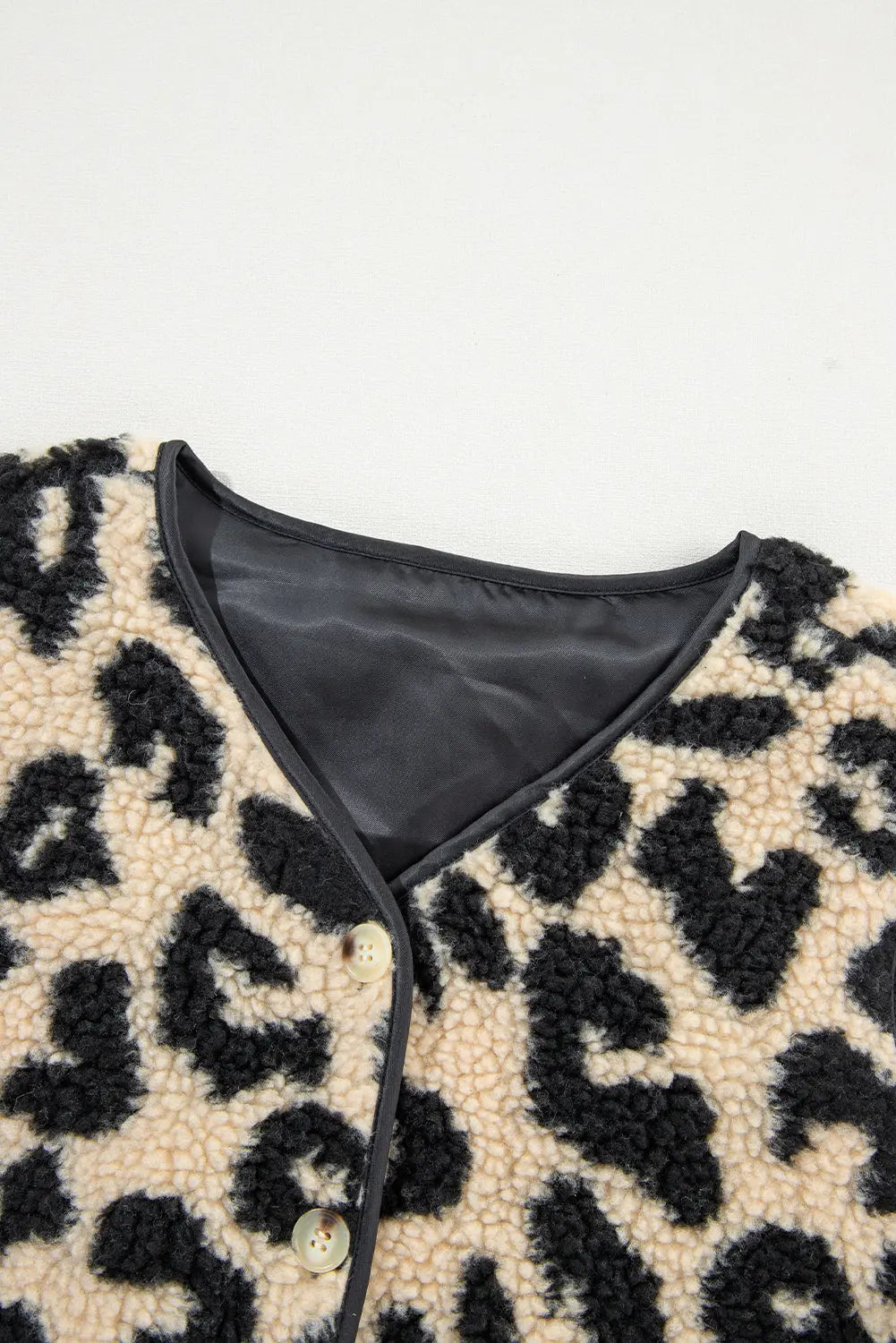 Cream leopard print sherpa vest coat V neck collar, detail view · nz-alt-v1