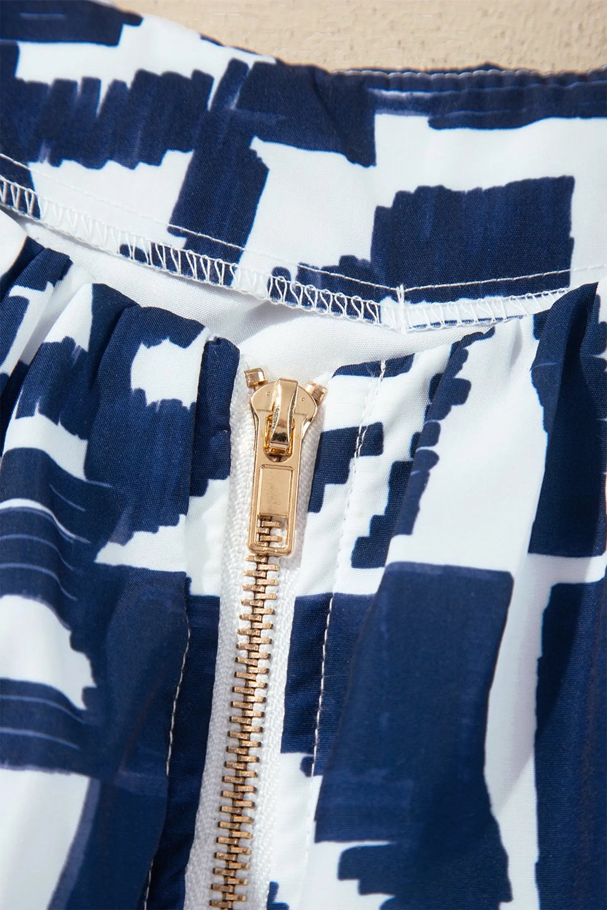 Blue Abstract Geometric Print Zip Front Tie Waist Shift Dress gold zipper detail view · nz-alt-v1