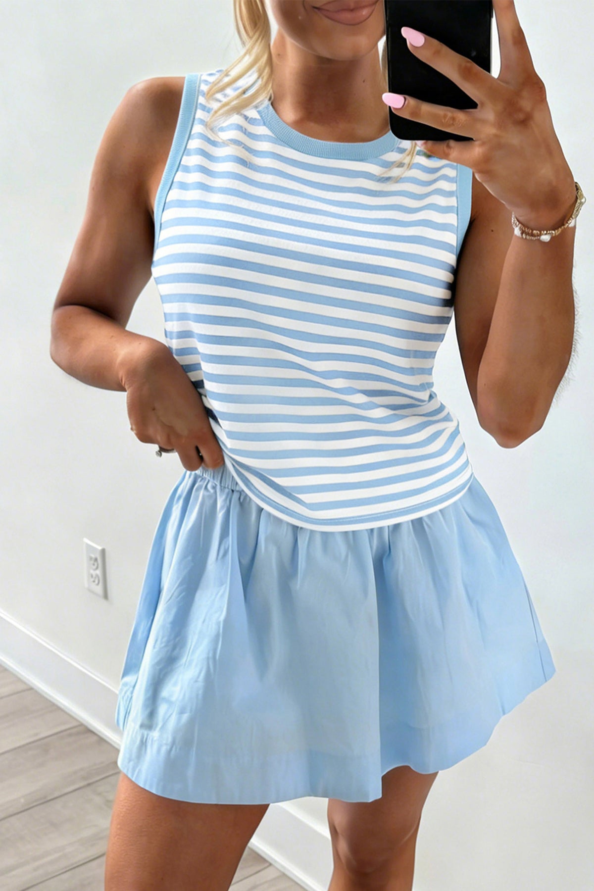 Sky blue stripe slim tank and ruffle mini skort set model front view, closer crop