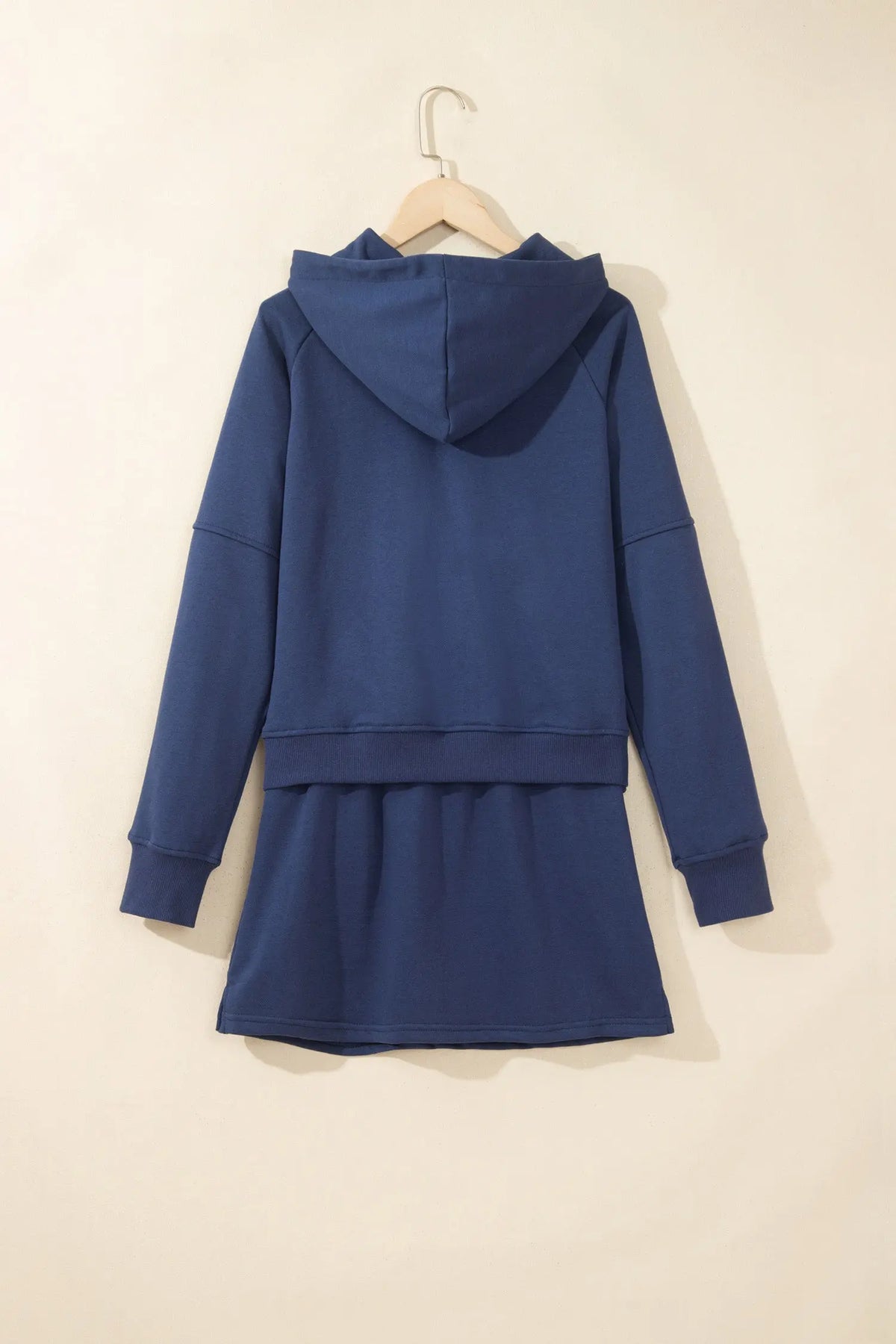 Navy blue long sleeve zip-up top elastic waist skort set hanging view · nz-alt-v1