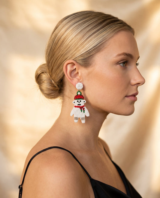 Beaded Snowman Christmas Drop Earrings worn, side profile · nz-on-model-v1