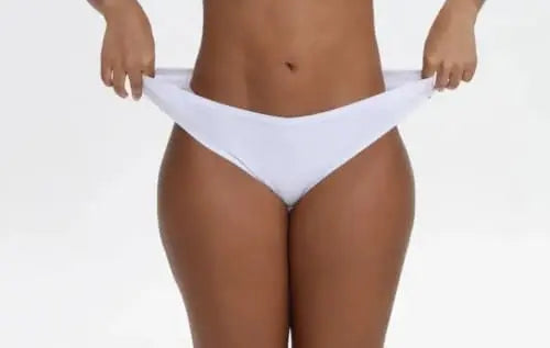 Nataliz stretch cotton thong front waistband stretch detail on model