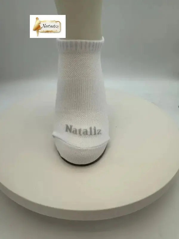 White sock with 'Natalia' branding on a white background